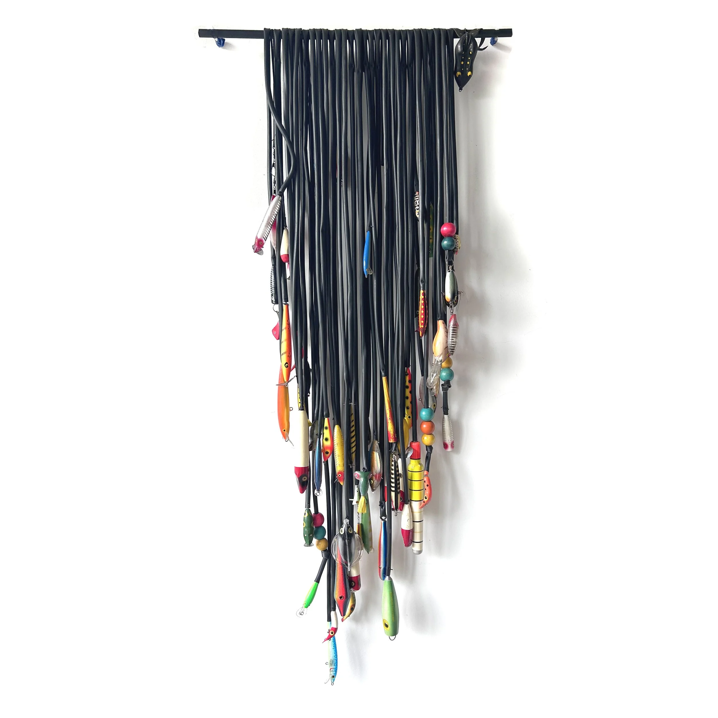 Alluring, 2026. Salvaged and found objects, 21.5x46".