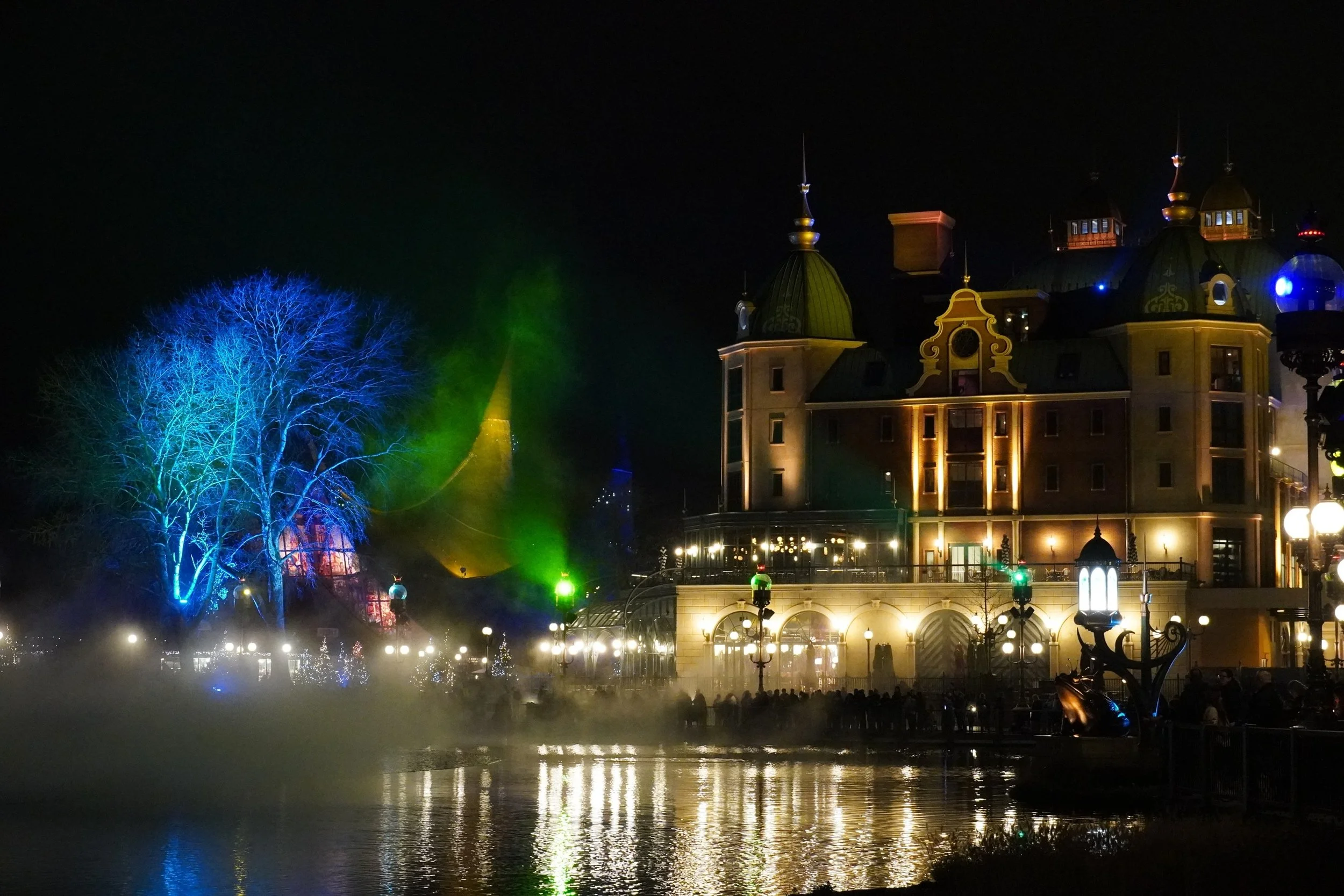 House of the Five Senses and the Grand Hotel at night behind Aquanura at Winter Efteling on a Christmas Theme Park Tour with Coaster Breaks