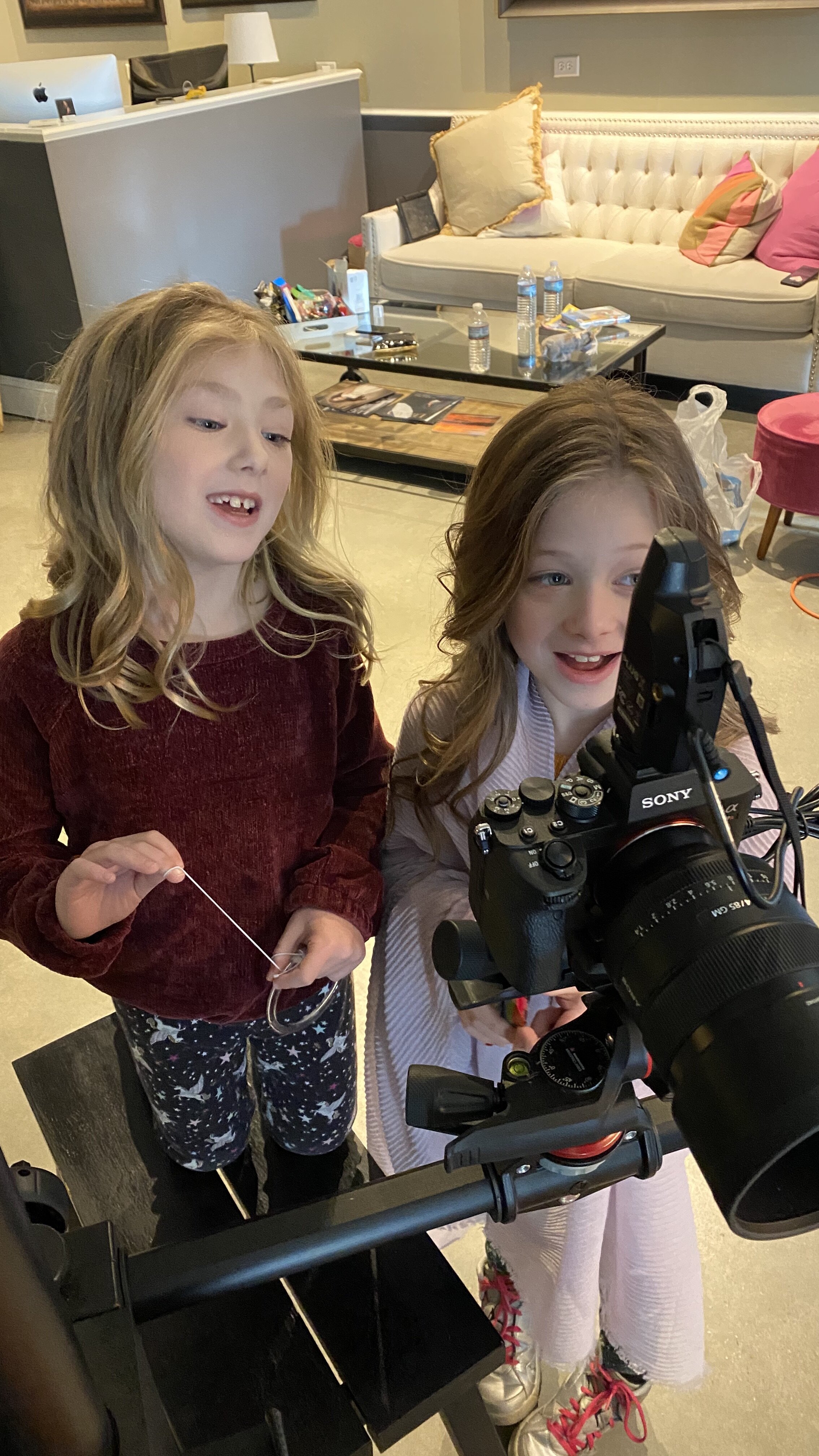 children-looking behind-the-camera-reacting-to-portrtiat-picture-image