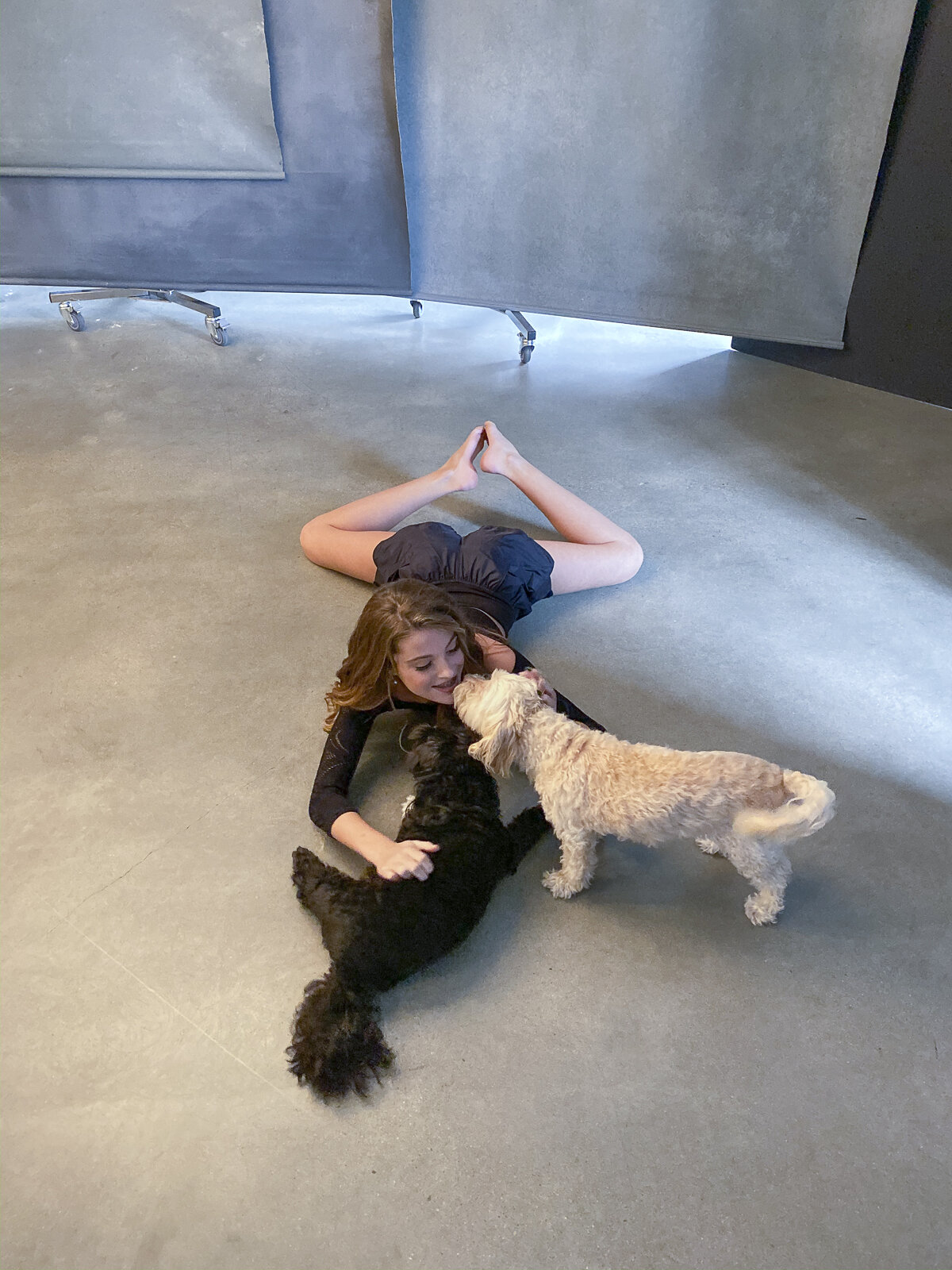 dancer-black-label-stretching-on-set-in-studio-with-dogs-muppet-and-lucy