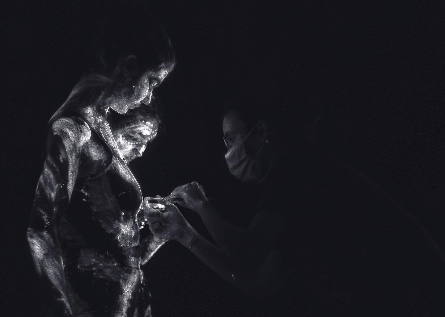 @natalia.hussein touches up @elodelicious and @gemmosz 's UV Body paint between takes. 

Natalias design for the paint evolved from very detailed, intricate, neat paintwork to much more free and uncontrolled swathes of paint that, under UV Light, LUT
