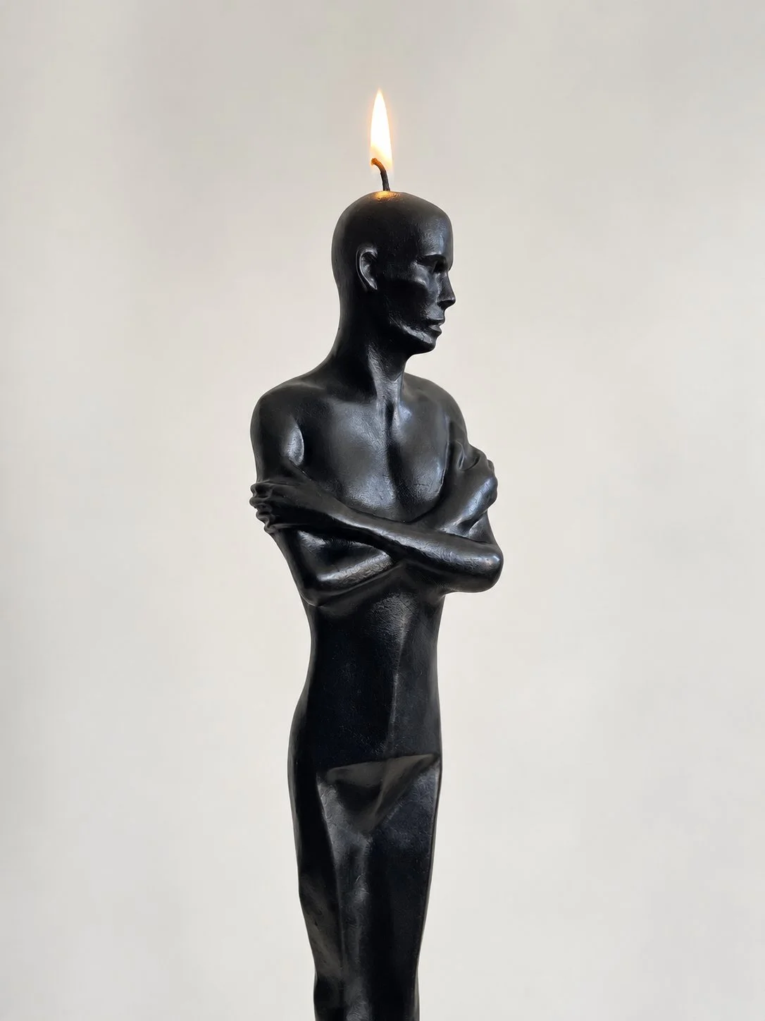 Sculptural Black Figure Candle.jpeg