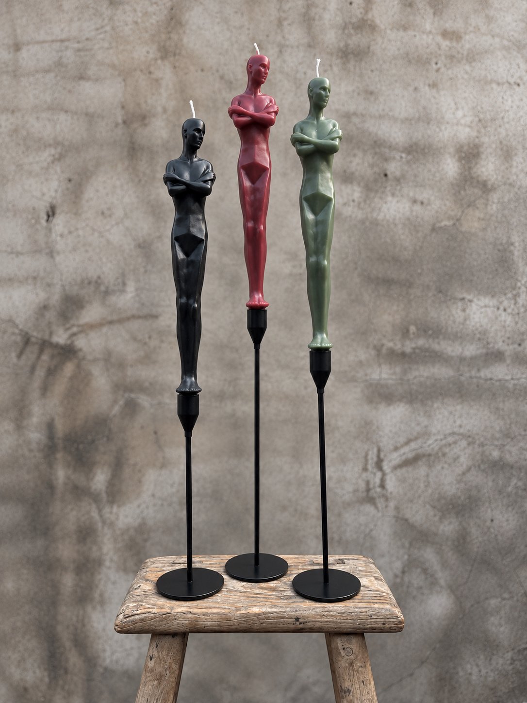 Three Modernist Wick Sculptures on a Rustic Bench.jpeg