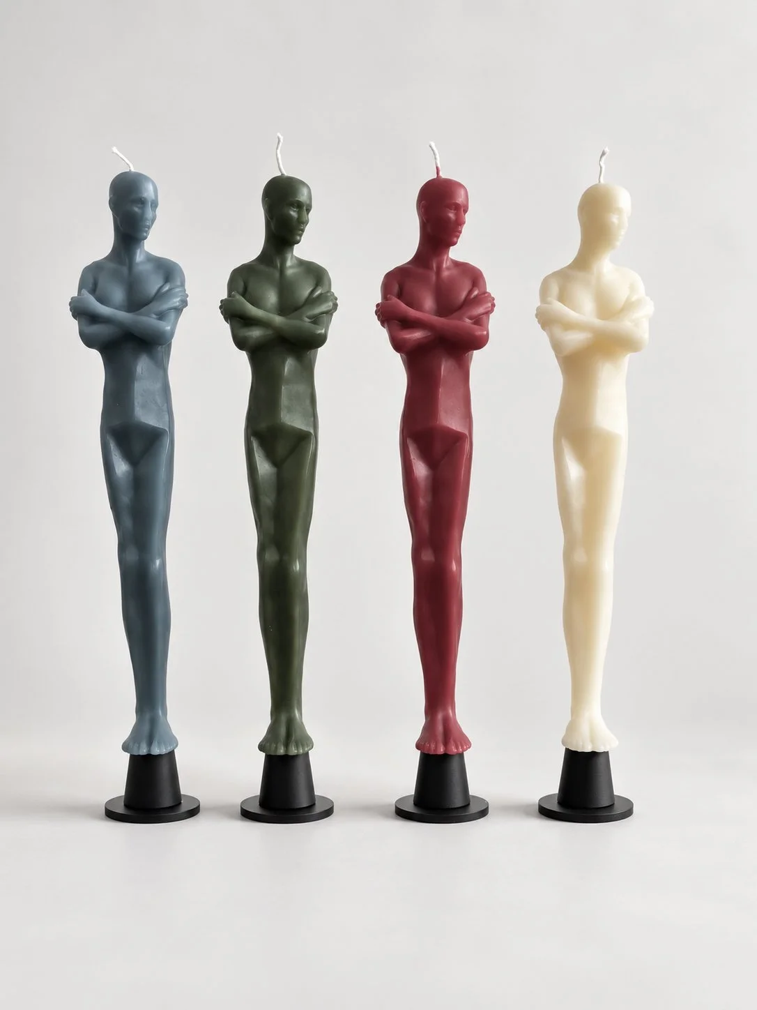 Four Sculptural Figure Candles.jpeg