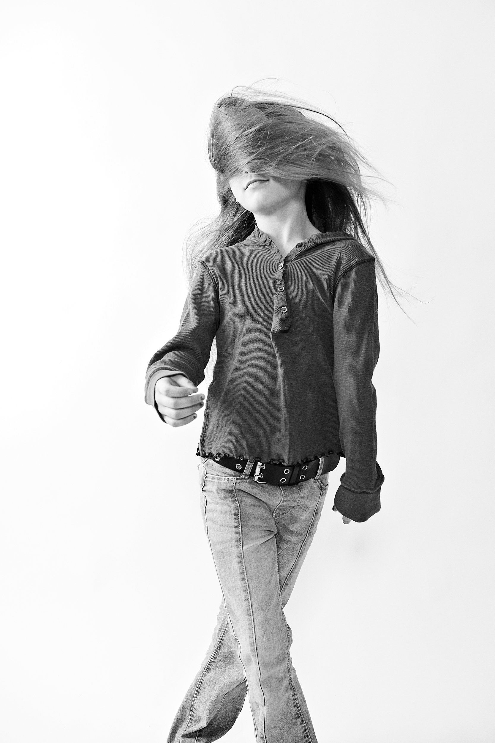 little girl with hair in her face. black and white image on white background. portsmouth NH