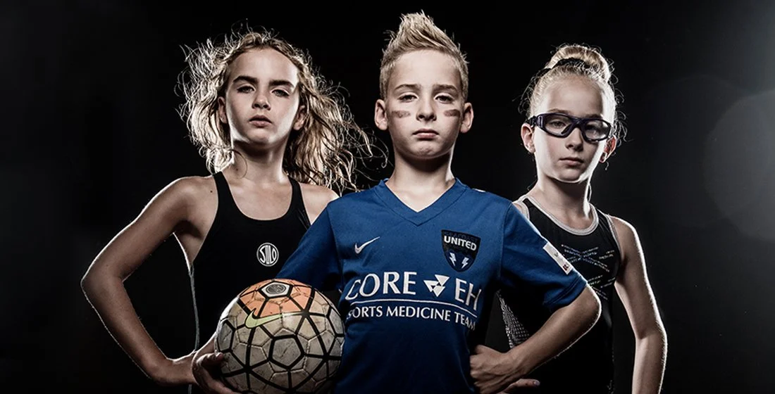 young triplets, 2 girls and a boy, athletes against a black background. one is a swimmer, one is a soccer player and one is a gymnast. strong. Portsmouth nh
