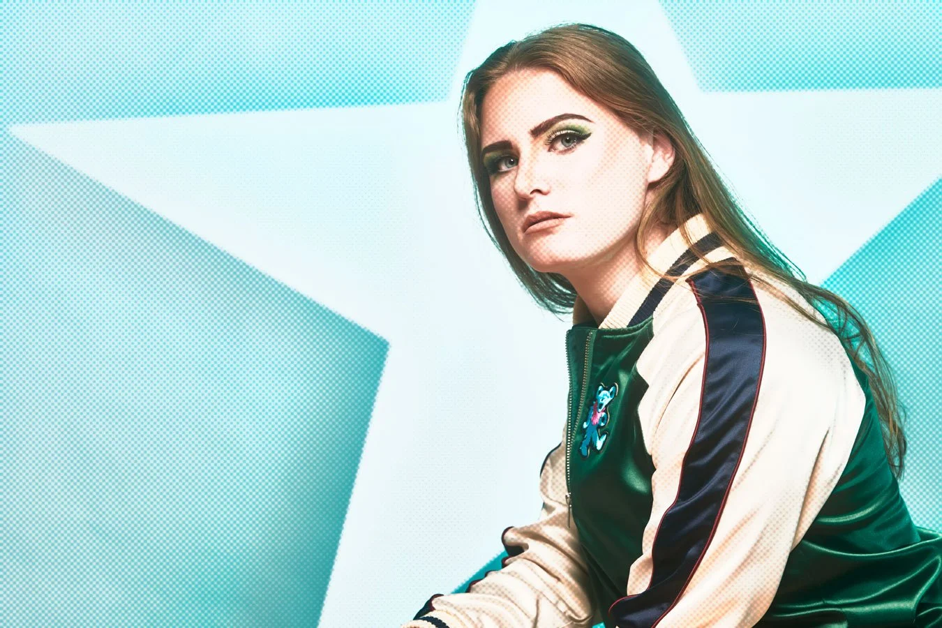 Brooke Shields look alike posing against a blue background with a star. fashion. Portsmouth NH