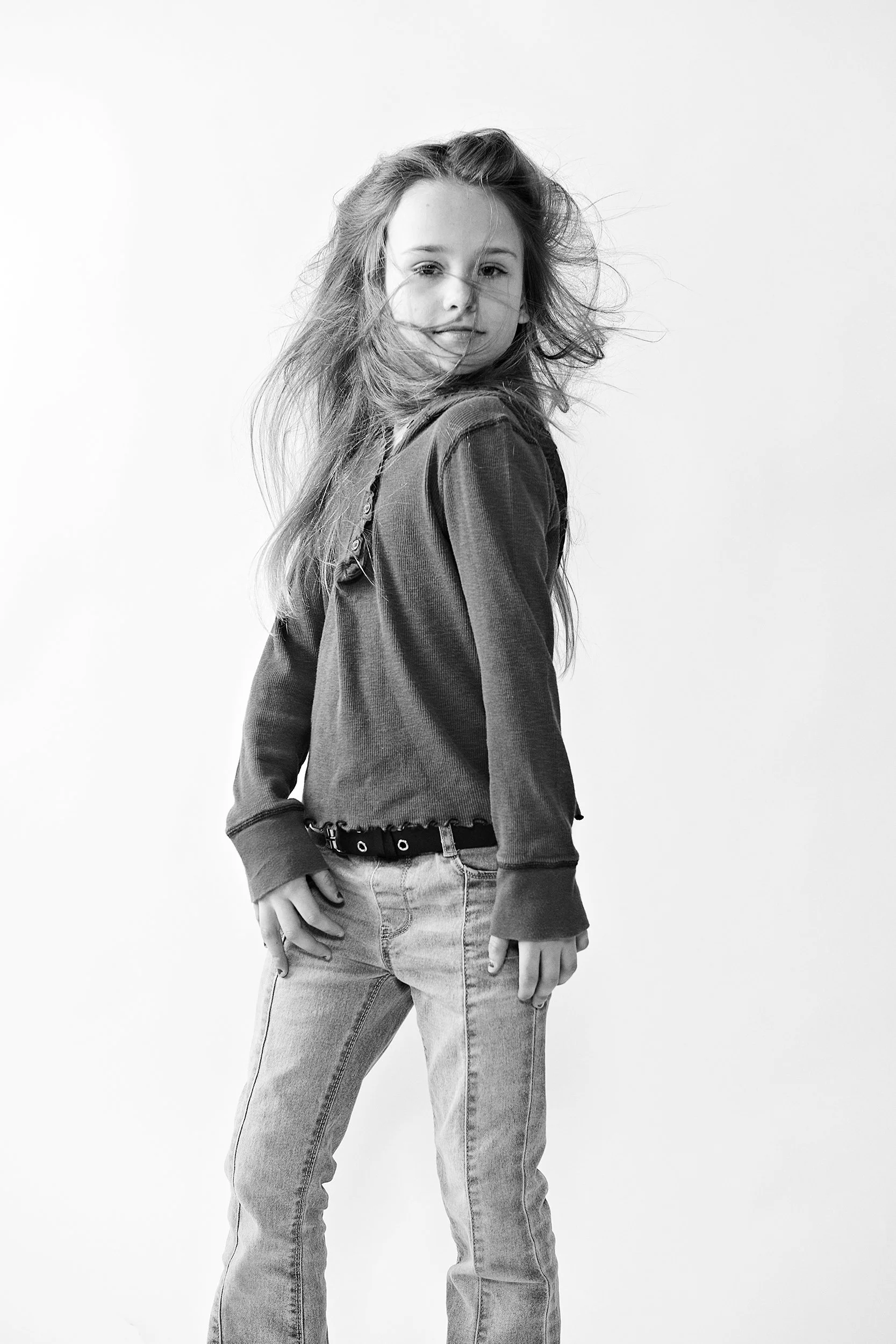 little girl dancing with hair in her face. black and white image on white background. portsmouth NH