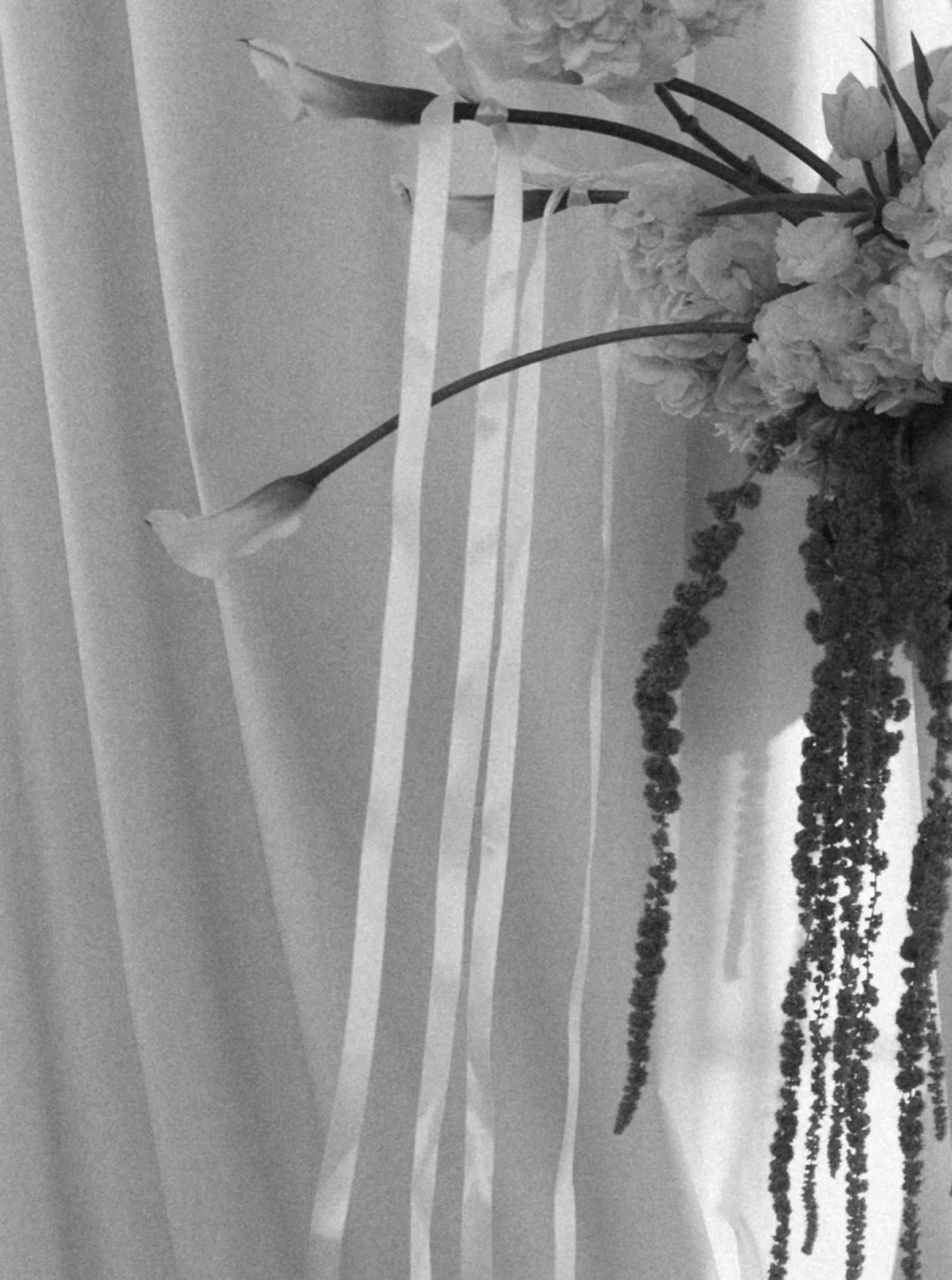 Modern chic branding shoot for an interior designer white and green flowers amaranth calla lilies anthurium hydrangea the cottage rose kansas city wedding florist crossroads pedestal floral installation draped fabric white ribbons bows