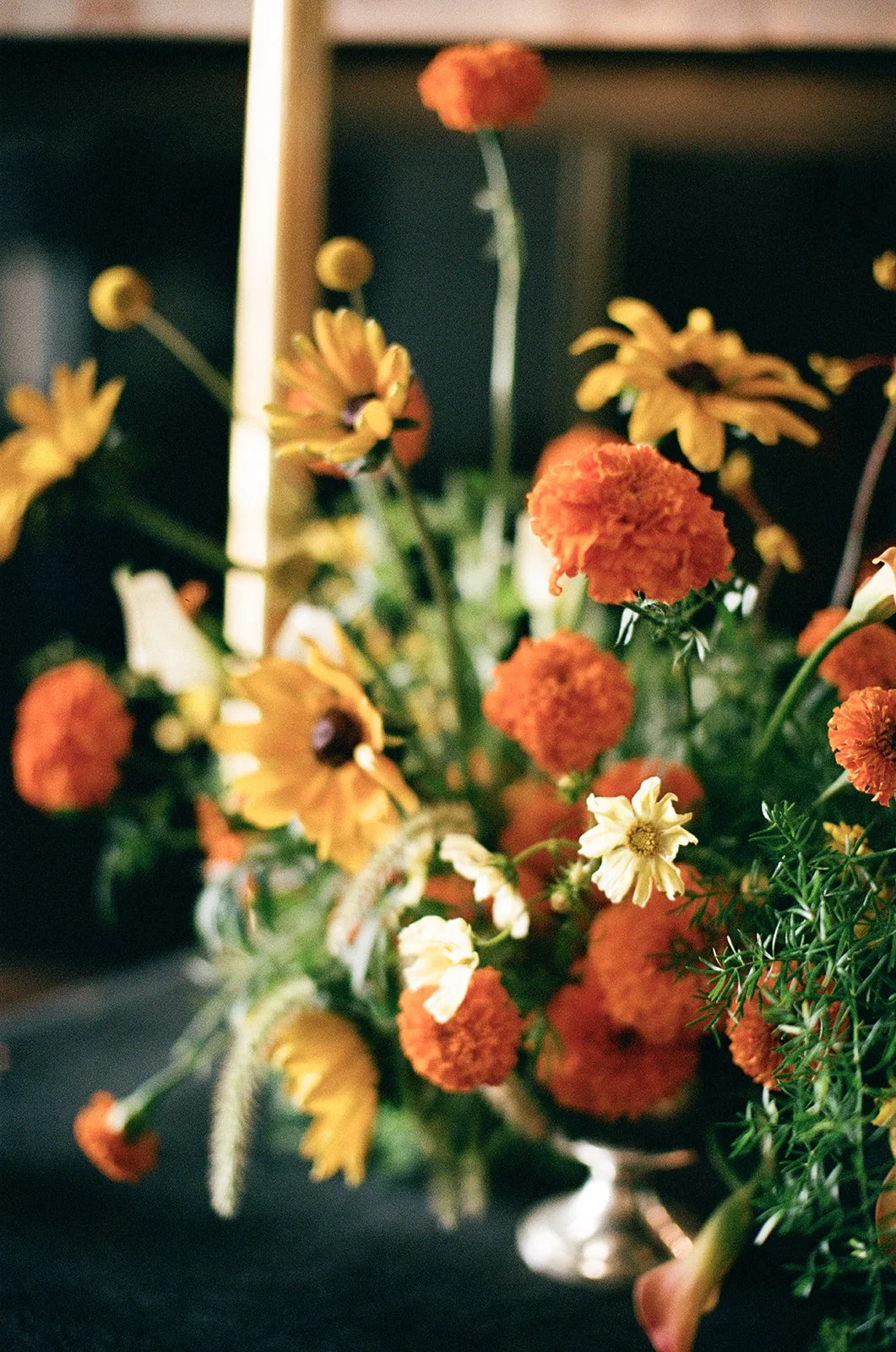 Modern september wedding orange and yellow color palette seasonal flowers calla lilies marigolds bar arrangement wedding bridal portraits the cottage rose kansas city wedding florist crossroads hotel kansas city wedding