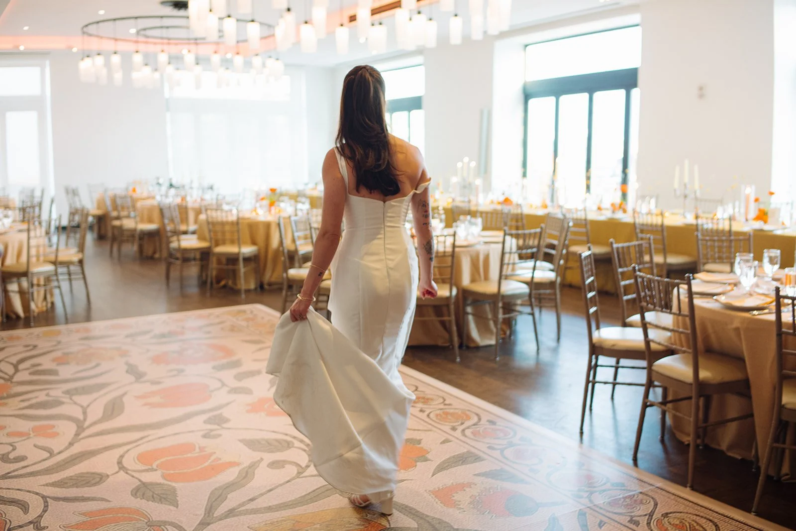 Modern september wedding reception orange and yellow color palette craspedia bud vases centerpieces silver candelabra  the cottage rose kansas city wedding florist crossroads hotel kansas city wedding orange marigold ikebana head table candles