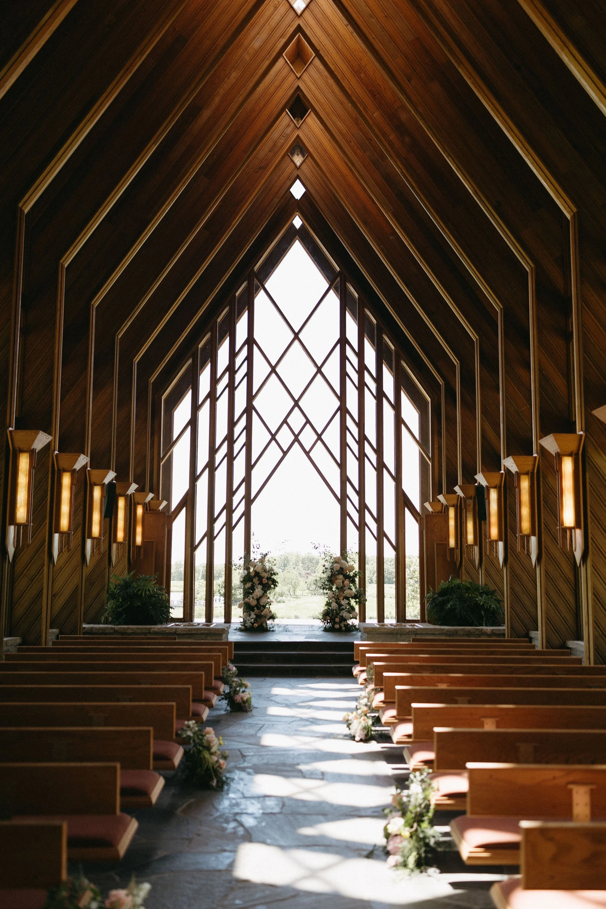 modern spring garden wedding warm color palette yellow peach lilac the cottage rose kansas city florist crossroads powell garden ceremony floral column installation ceremony flower arrangement peonies anthurium garden roses ranunculus orchids aisle