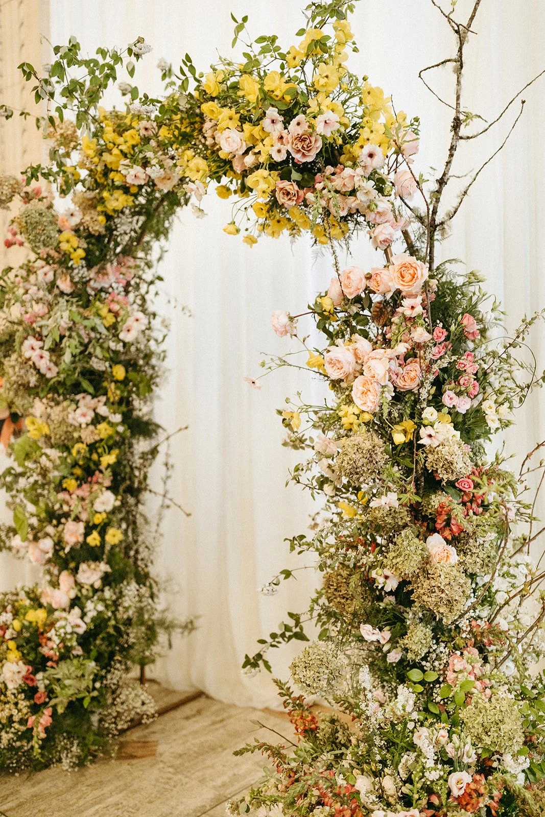 ceremony flowers large lush floral arch ceremony backdrop modern garden wedding flowers  the grand hall downtown kc the cottage rose kansas city wedding florist crossroads