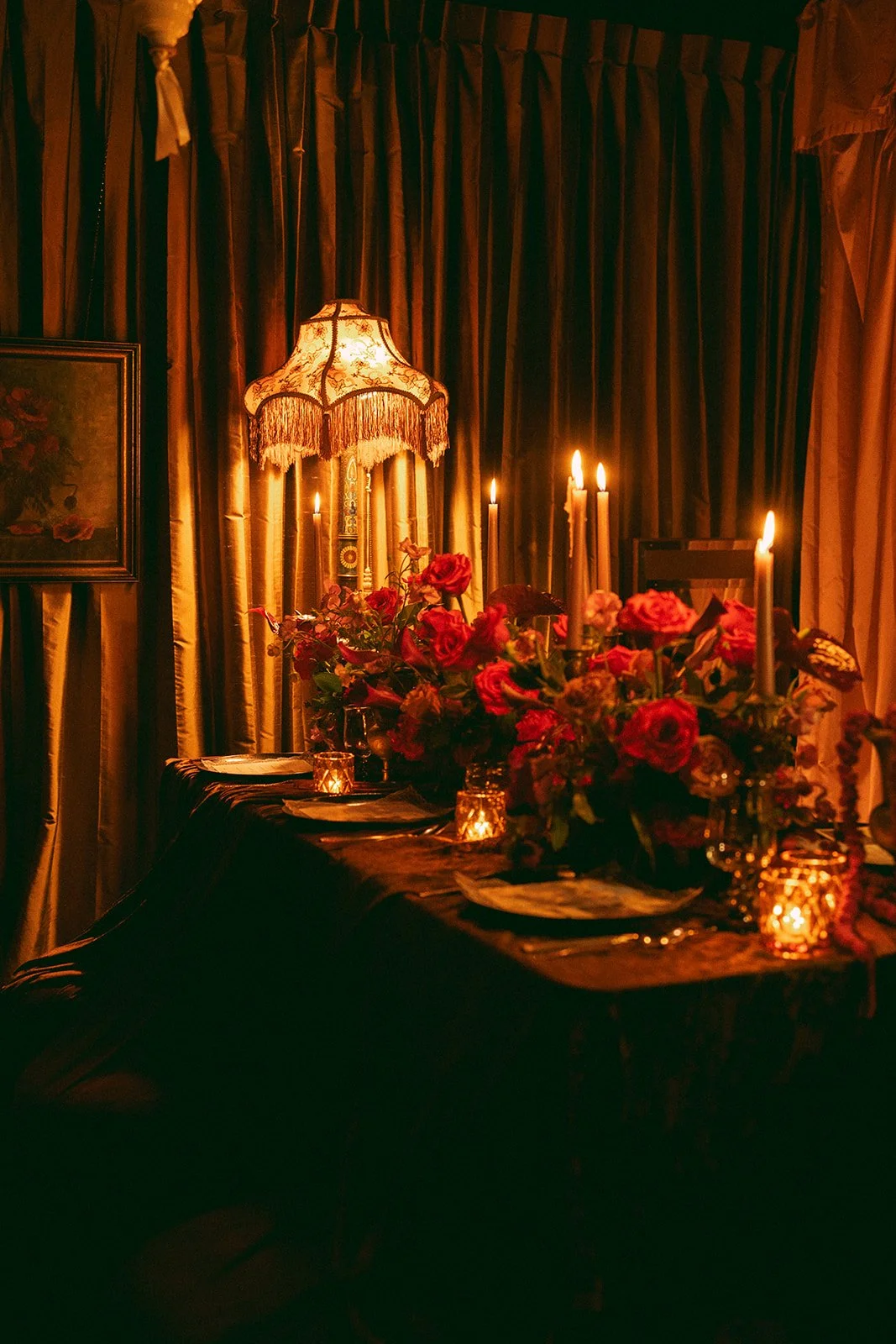 Vintage maximalist more is more wedding inspiration full lush florals pop of red vintage candelabra head table decor le lounge kansas city wedding florist the cottage rose crossroads spring wedding decor brown fabric orchid amaranth lace fringe