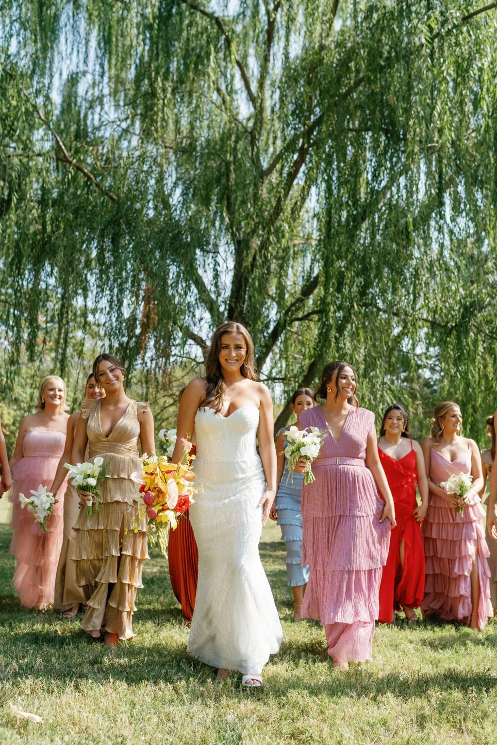 Modern eclectic luxury wedding on the lawn at liberty memorial greenhouse tent wedding outdoor reception fall wedding october the cottage rose kansas city wedding florist crossroads bride bridesmaids colorful dressed white and green bouquets