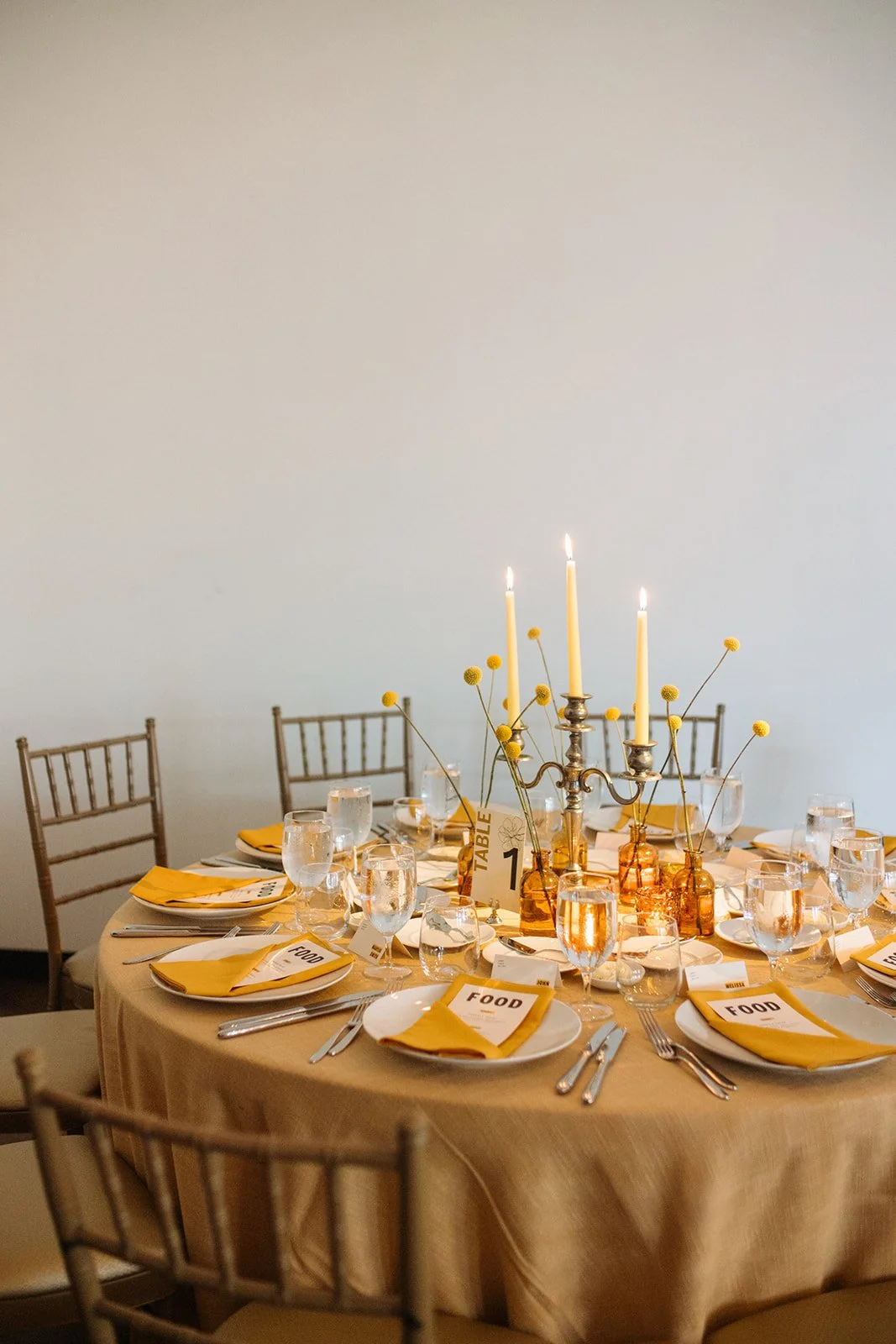 Modern september wedding reception orange and yellow color palette craspedia bud vases centerpieces silver candelabra  the cottage rose kansas city wedding florist crossroads hotel kansas city wedding