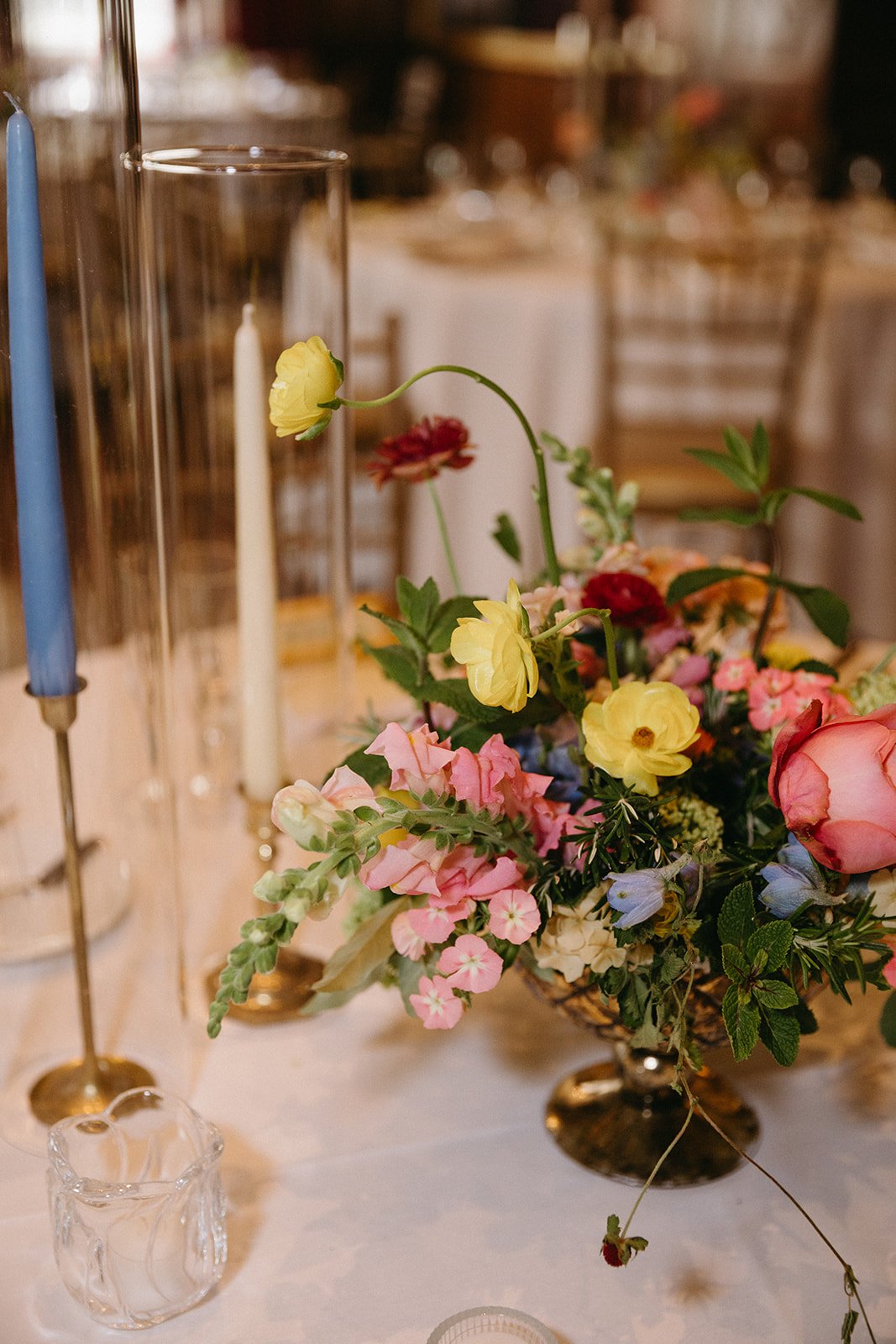 candlelit whimiscal spring garden wedding pastel color palette same sex wedding reception table floral centerpieces downtown kc hotel kansas city the cottage rose kansas city wedding florist crossroads