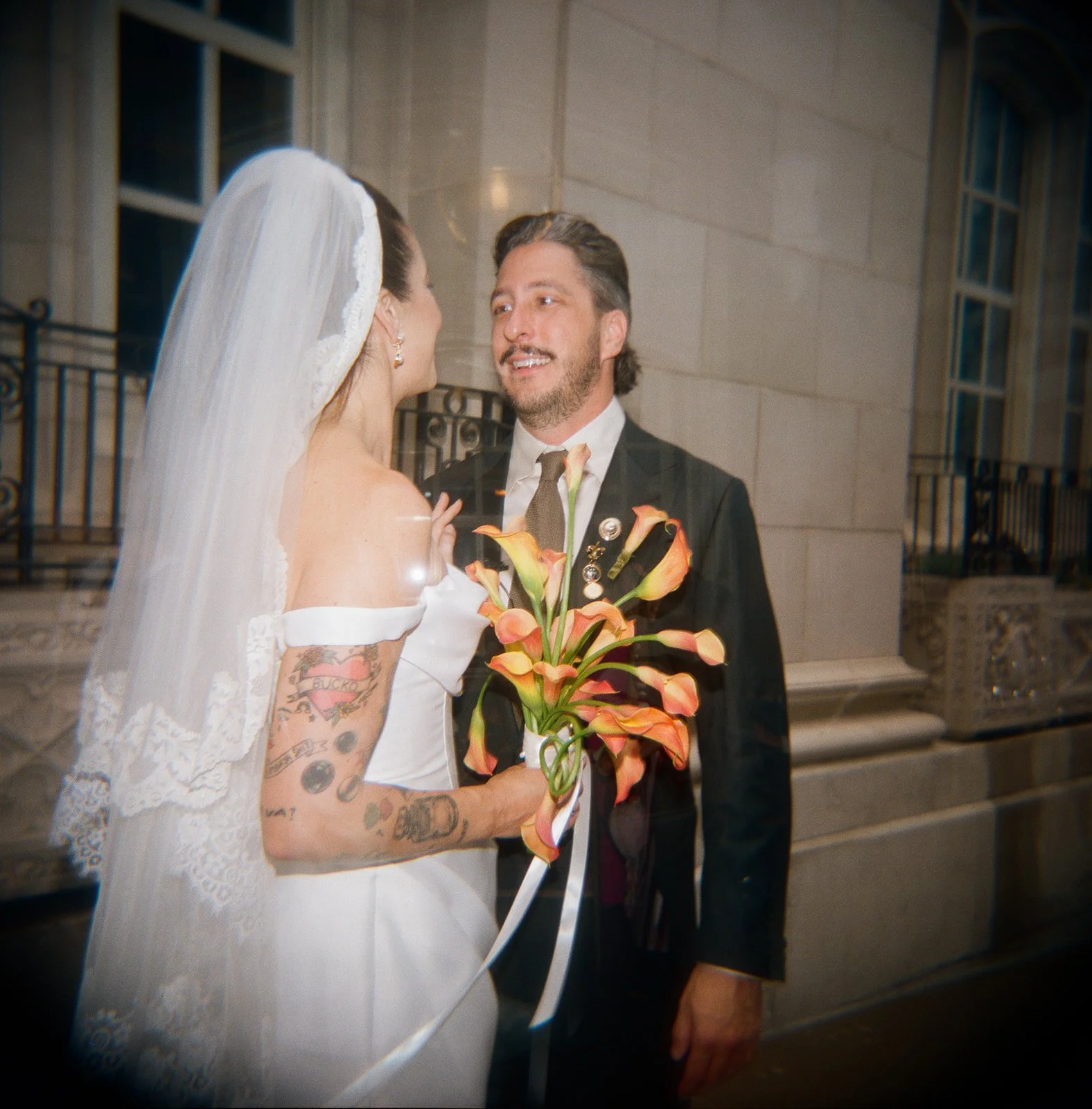 Modern september wedding orange and yellow calla lily bridal bouquet wedding bride and groom first look the cottage rose kansas city wedding florist crossroads hotel kansas city wedding