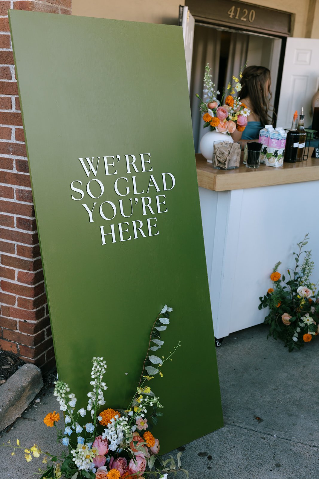 colorful flower filled october wedding in midtown kansas city la villa bridal bouquet wedding bouquet wedding flowers orchids garden roses ranunculus the cottage rose kansas city wedding florist crossroads green welcome sign flower arrangement