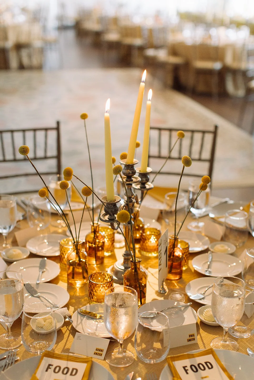 Modern september wedding reception orange and yellow color palette craspedia bud vases centerpieces silver candelabra  the cottage rose kansas city wedding florist crossroads hotel kansas city wedding