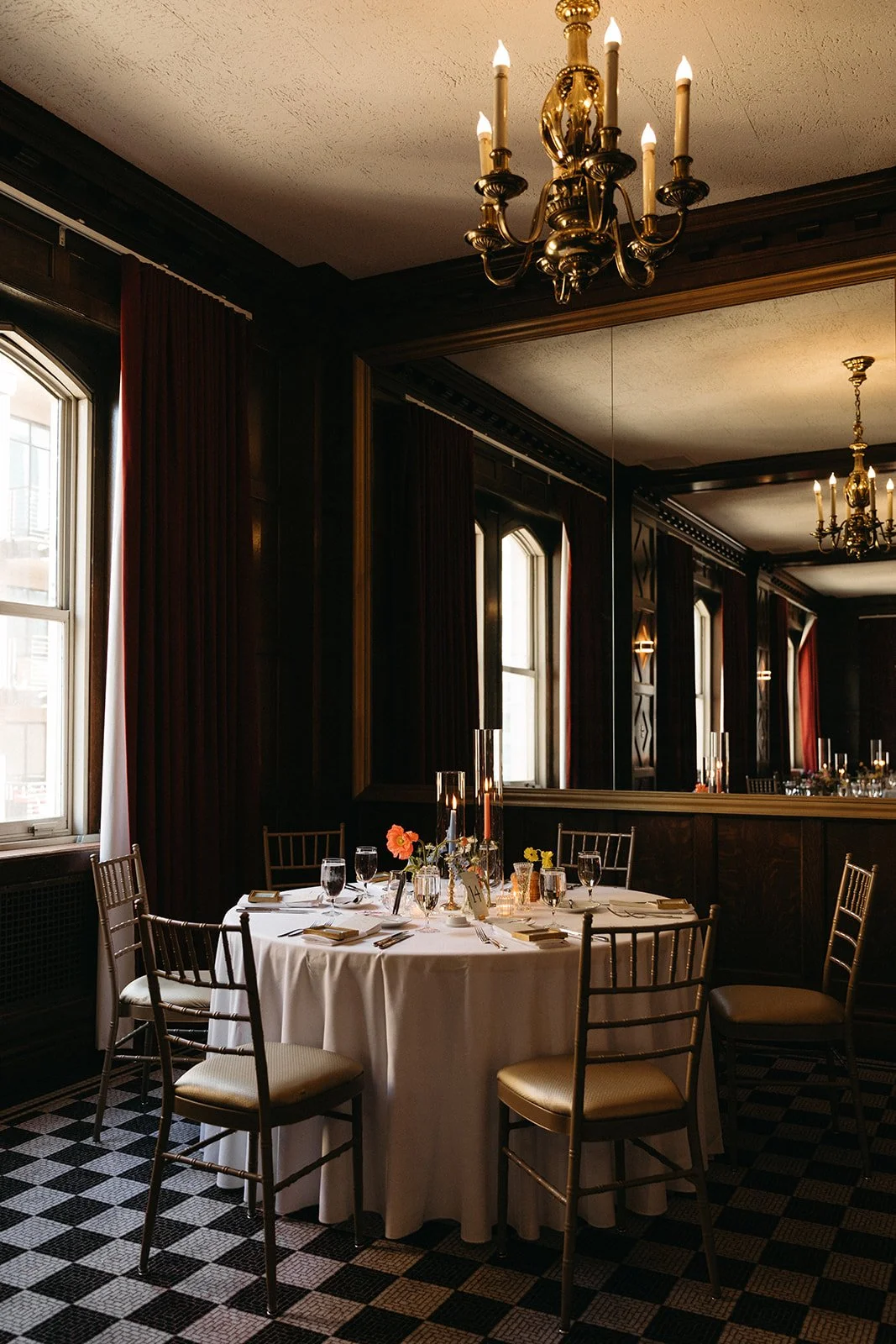 candlelit whimiscal spring garden wedding pastel color palette same sex wedding reception table floral centerpieces downtown kc hotel kansas city the cottage rose kansas city wedding florist crossroads bud vases