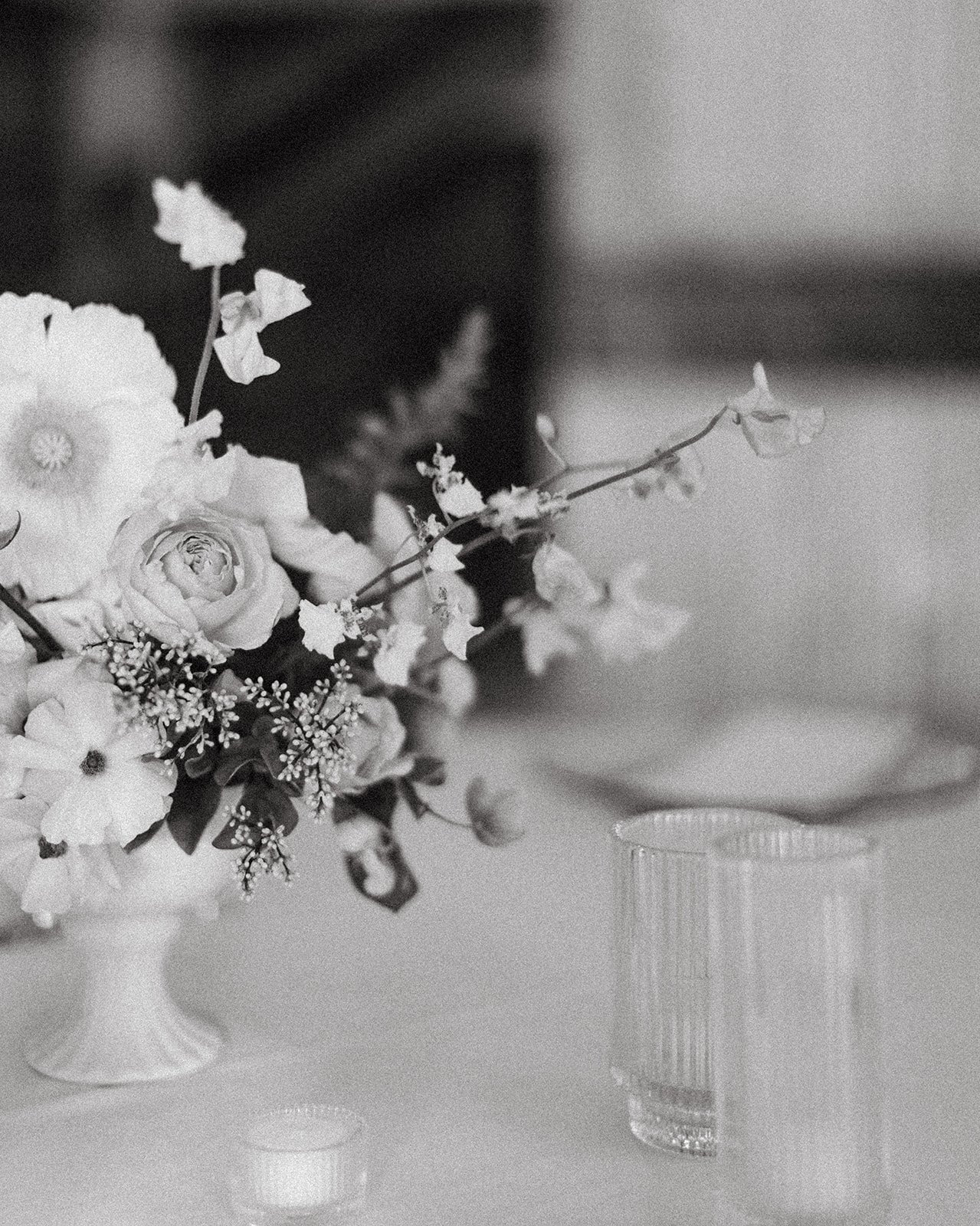 reception flowers centerpieces art deco ballroom venue flowers and candlesmodern garden wedding flowers  the grand hall downtown kc the cottage rose kansas city wedding florist crossroads floral compote black and white photo