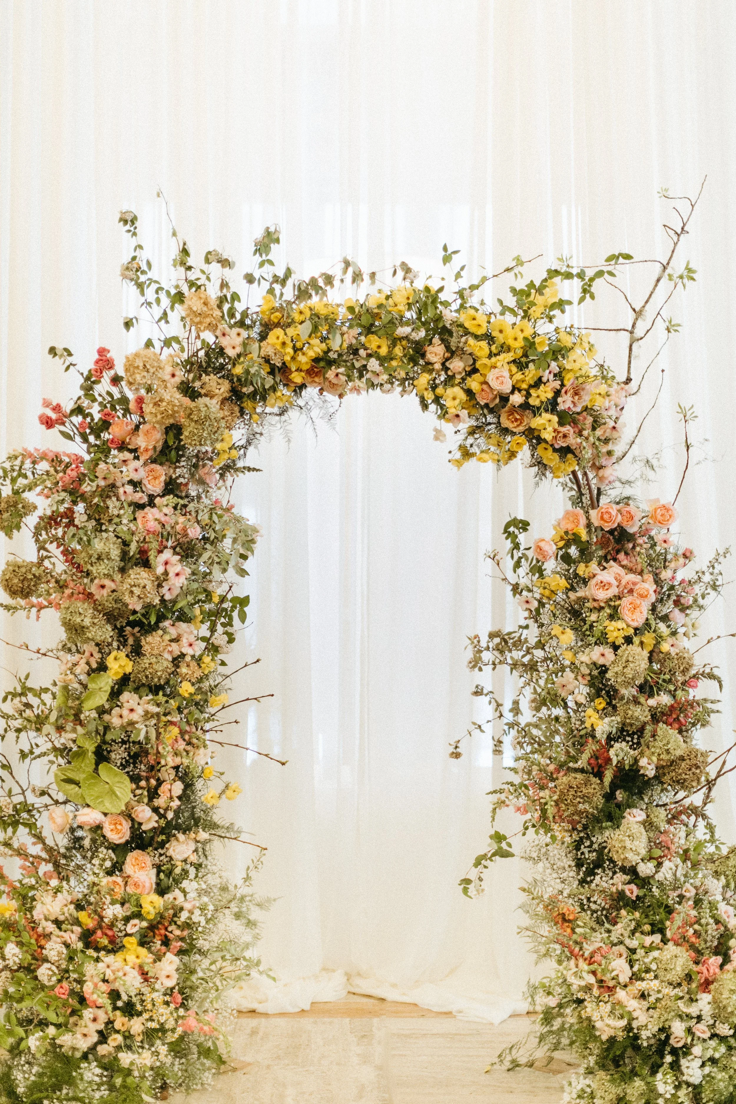 ceremony flowers large lush floral arch ceremony backdrop modern garden wedding flowers  the grand hall downtown kc the cottage rose kansas city wedding florist crossroads