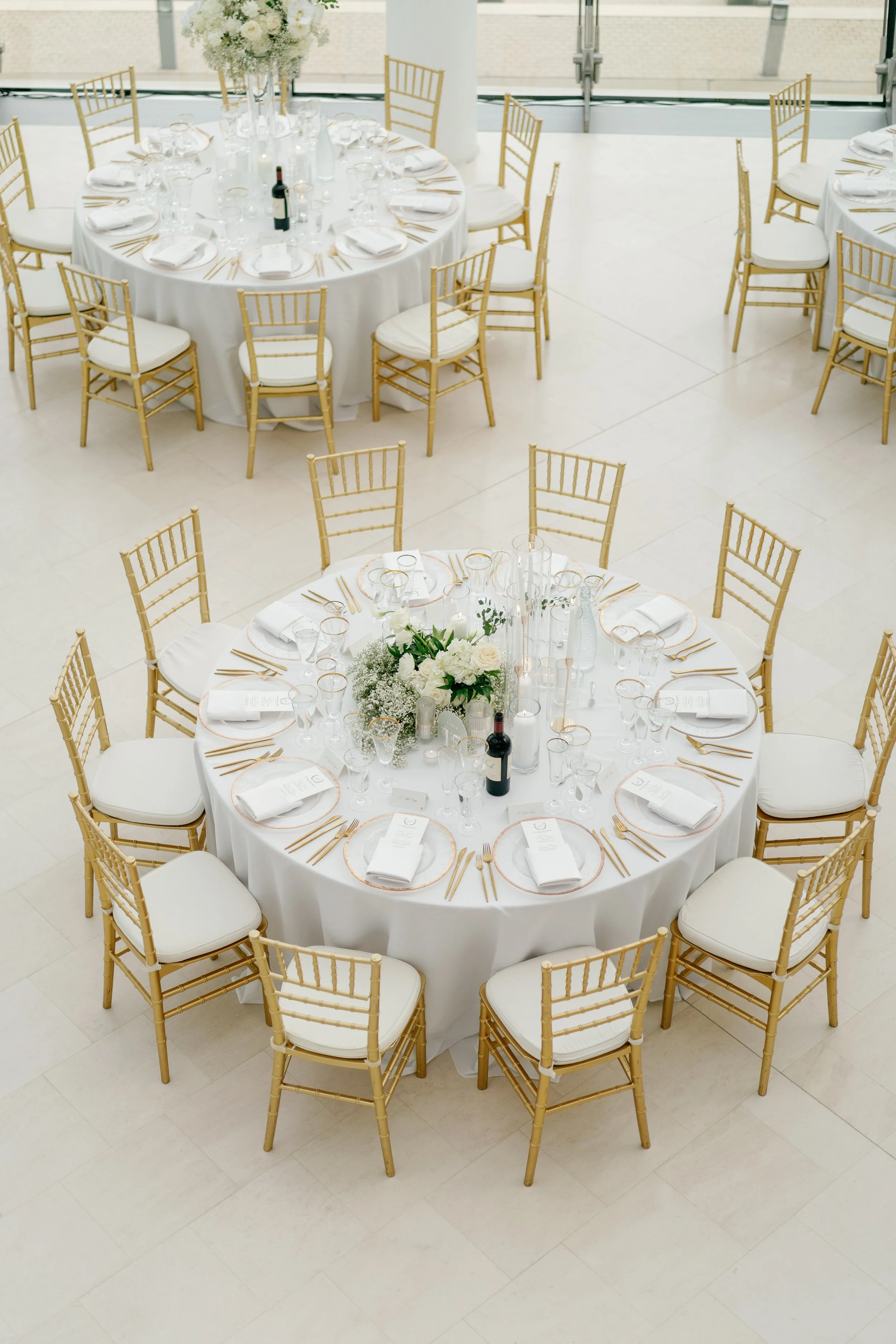 Modern chic spring wedding kauffman center for the performing arts cloud dancer inspiration head table garland tall centerpieces low floral arrangement babys breath orchids calla lilies the cottage rose kansas city wedding florist crossroads