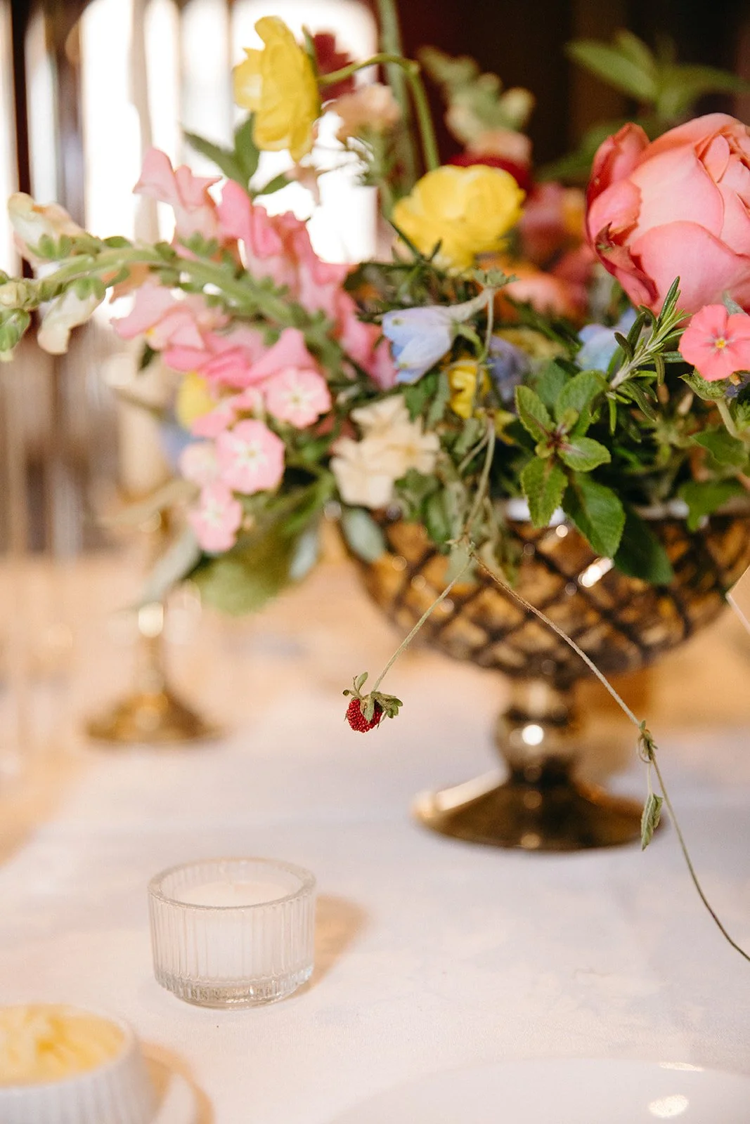 candlelit whimiscal spring garden wedding pastel color palette same sex wedding reception table floral centerpieces downtown kc hotel kansas city the cottage rose kansas city wedding florist crossroads