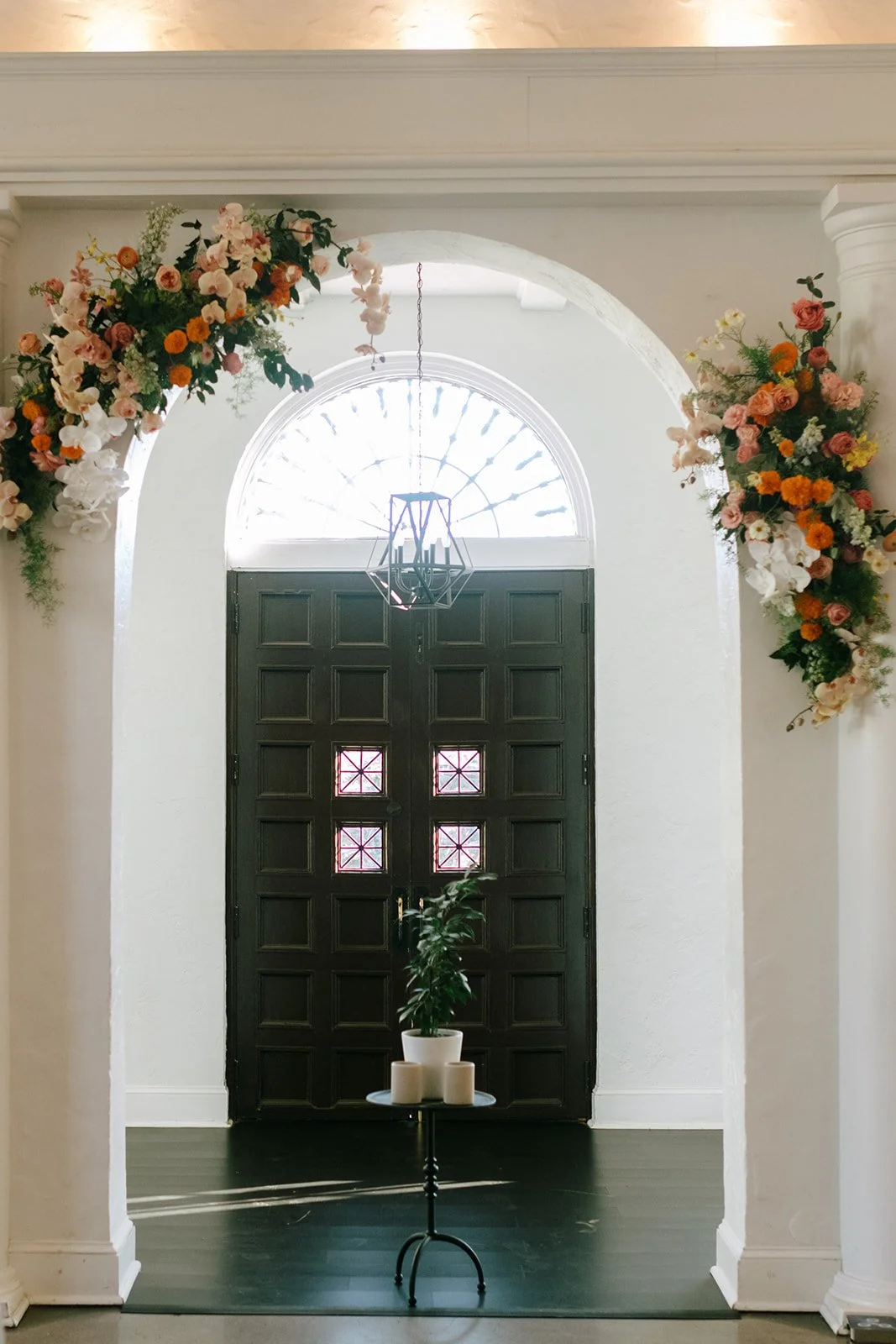 colorful flower filled october wedding in midtown kansas city la villa bridal bouquet wedding bouquet wedding flowers orchids garden roses ranunculus the cottage rose kansas city wedding florist crossroads ceremony hanging flower arrangement