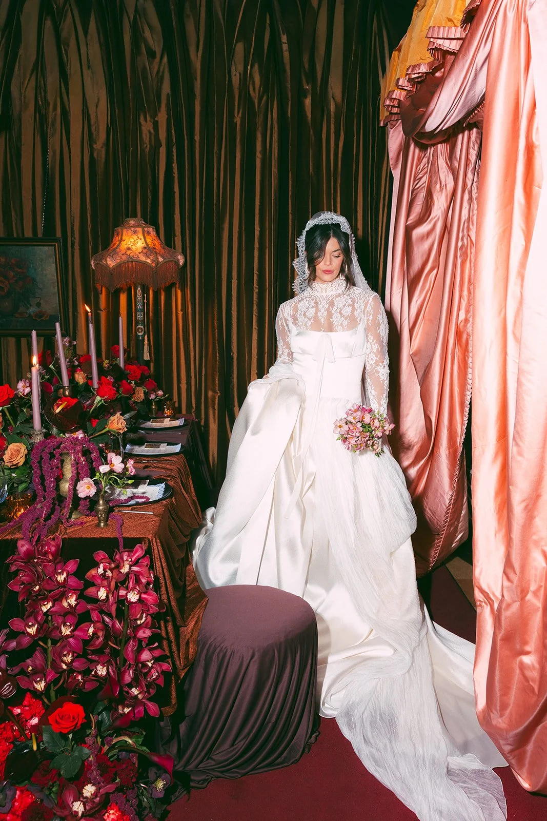 Vintage maximalist more is more wedding inspiration full lush florals pop of red modern victorian lace bridal look le lounge kansas city wedding florist the cottage rose crossroads spring wedding decor brown fabric orchids amaranth bride kc