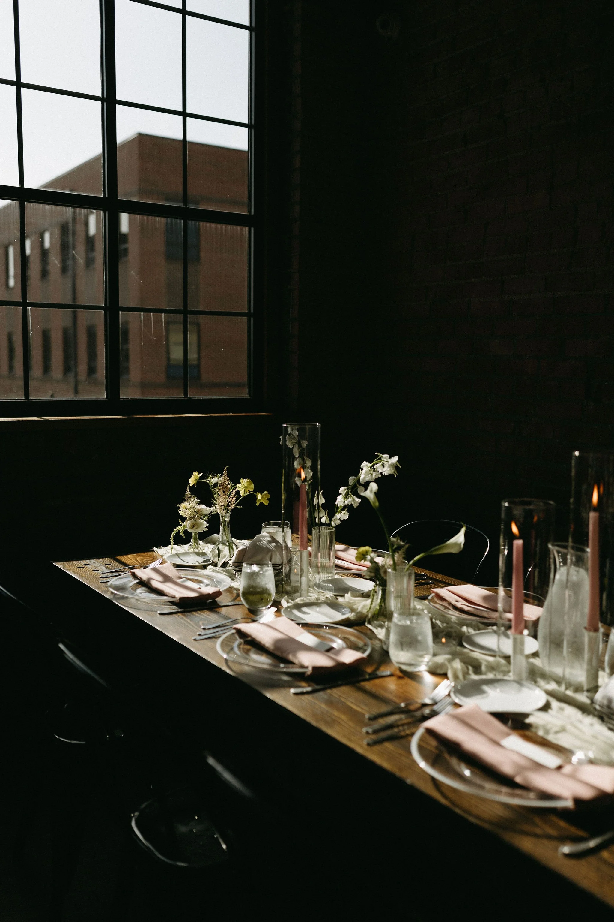 modern spring garden wedding warm color palette yellow peach lilac the cottage rose kansas city florist crossroads powell garden reception hanging greenery bud vases taper candles ikebana flower arrangements centerpieces