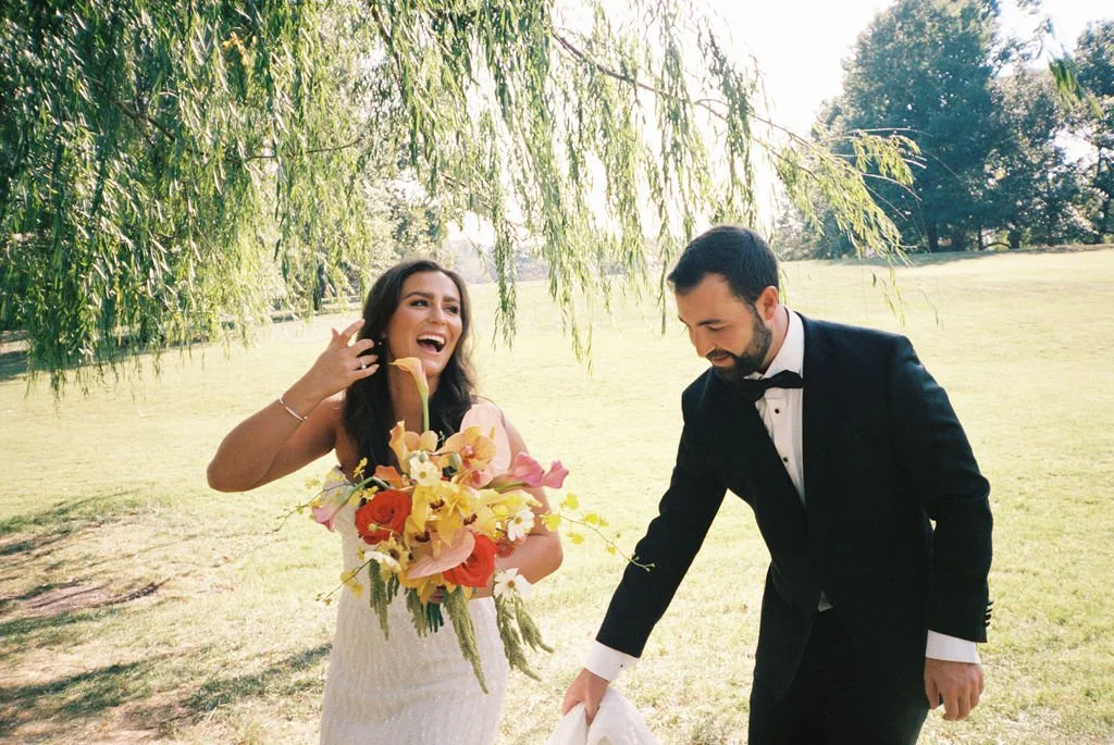 Modern eclectic luxury wedding on the lawn at liberty memorial greenhouse tent wedding outdoor reception fall wedding decor october the cottage rose kansas city wedding florist crossroads bride groom colorful orchid bridal bouquet anthurim callas