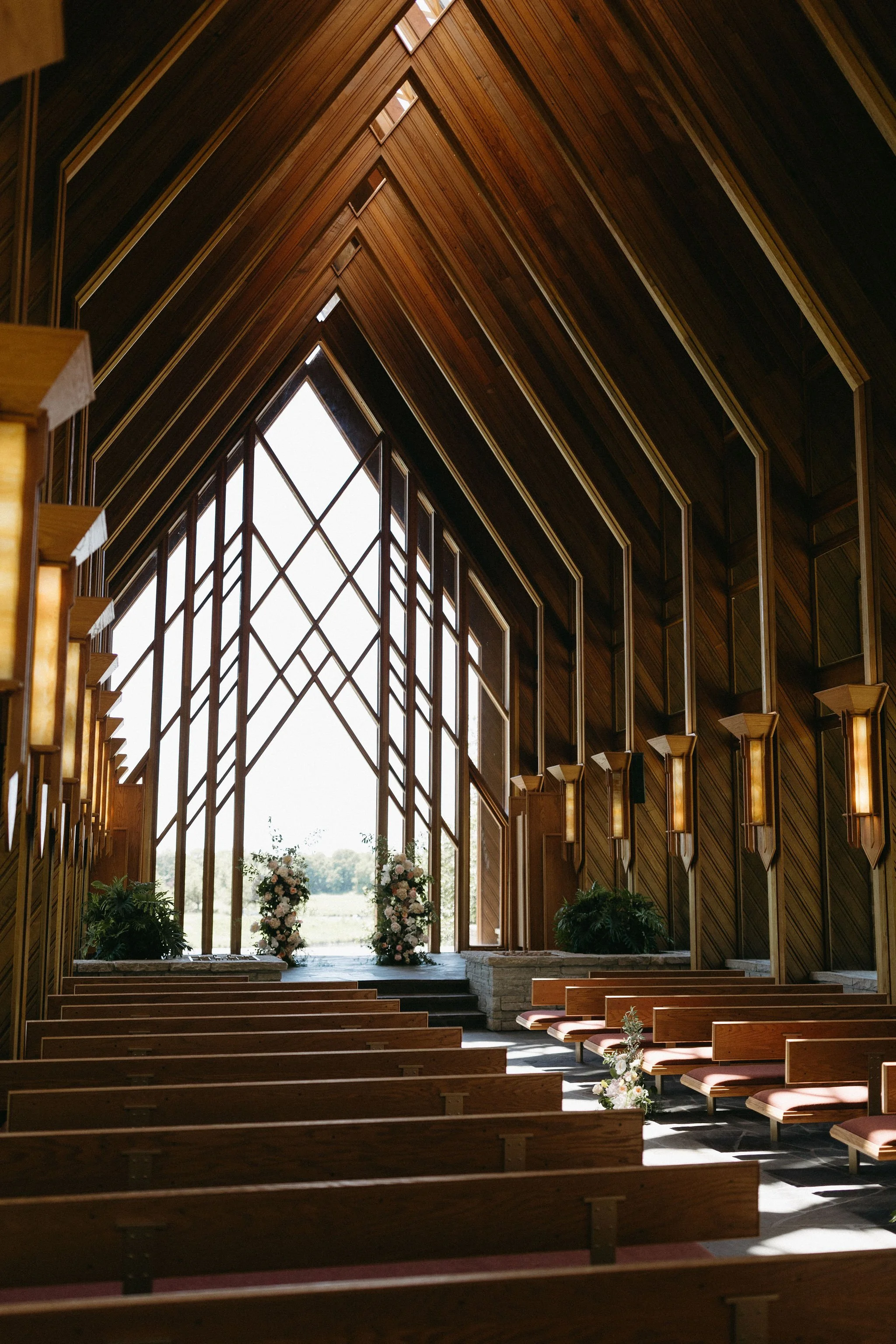 modern spring garden wedding warm color palette yellow peach lilac the cottage rose kansas city florist crossroads powell garden ceremony floral column installation ceremony flower arrangement peonies anthurium garden roses ranunculus orchids aisle