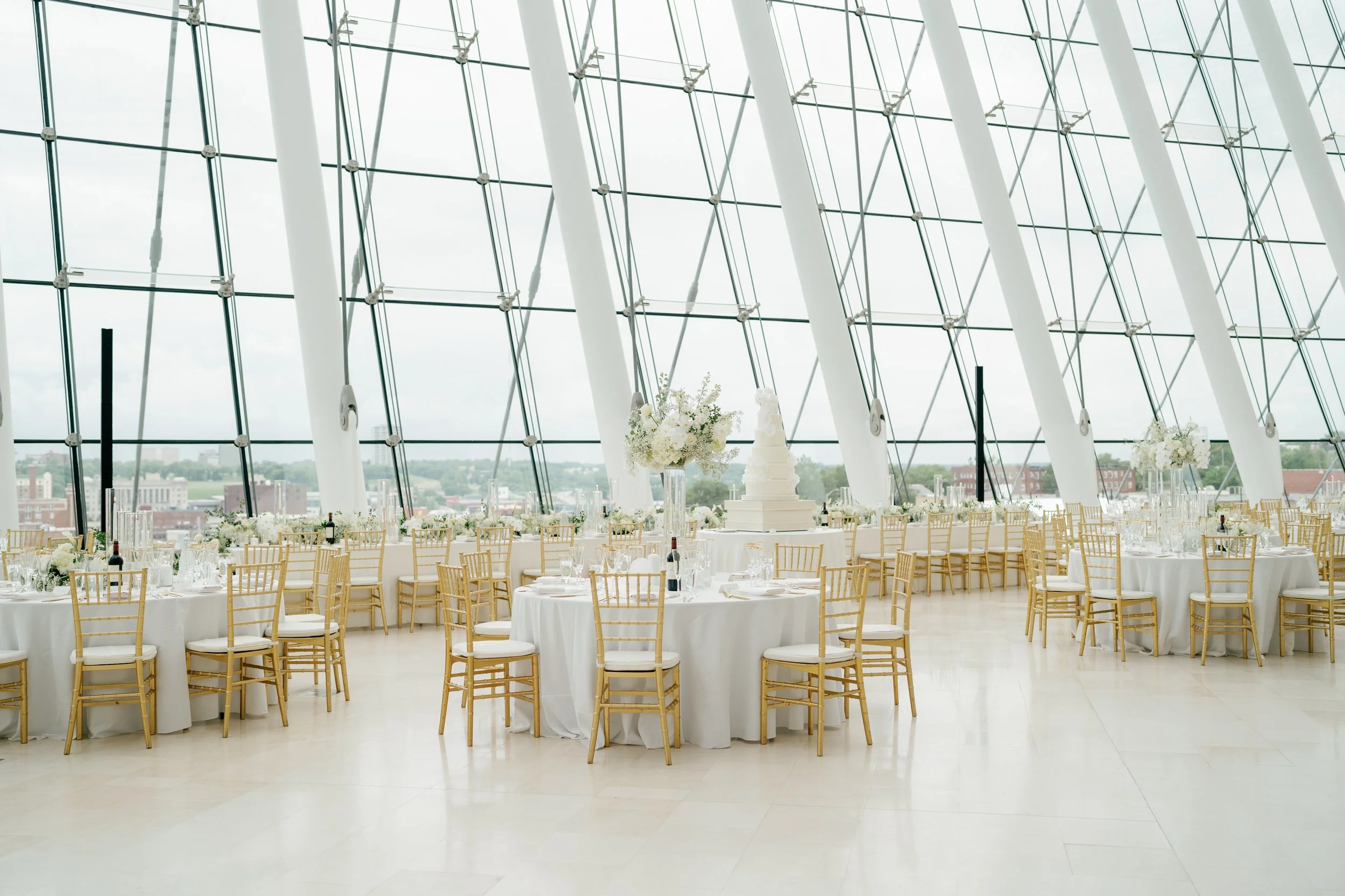 Modern chic spring wedding kauffman center for the performing arts cloud dancer inspiration head table garland tall centerpieces low floral arrangement babys breath orchids calla lilies the cottage rose kansas city wedding florist crossroads