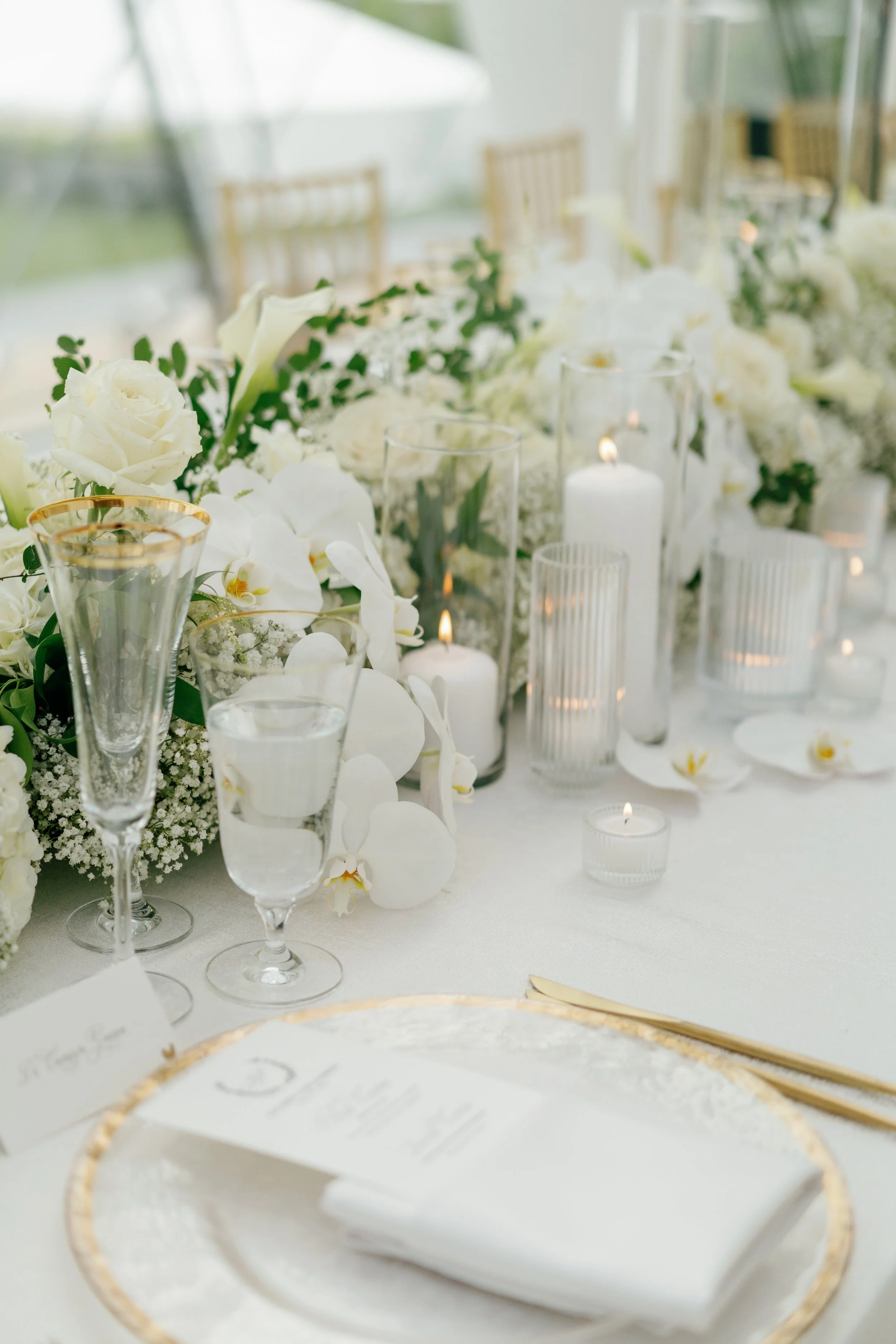 Modern chic spring wedding kauffman center for the performing arts cloud dancer inspiration head table garland tall centerpieces low floral arrangement babys breath orchids calla lilies the cottage rose kansas city wedding florist crossroads
