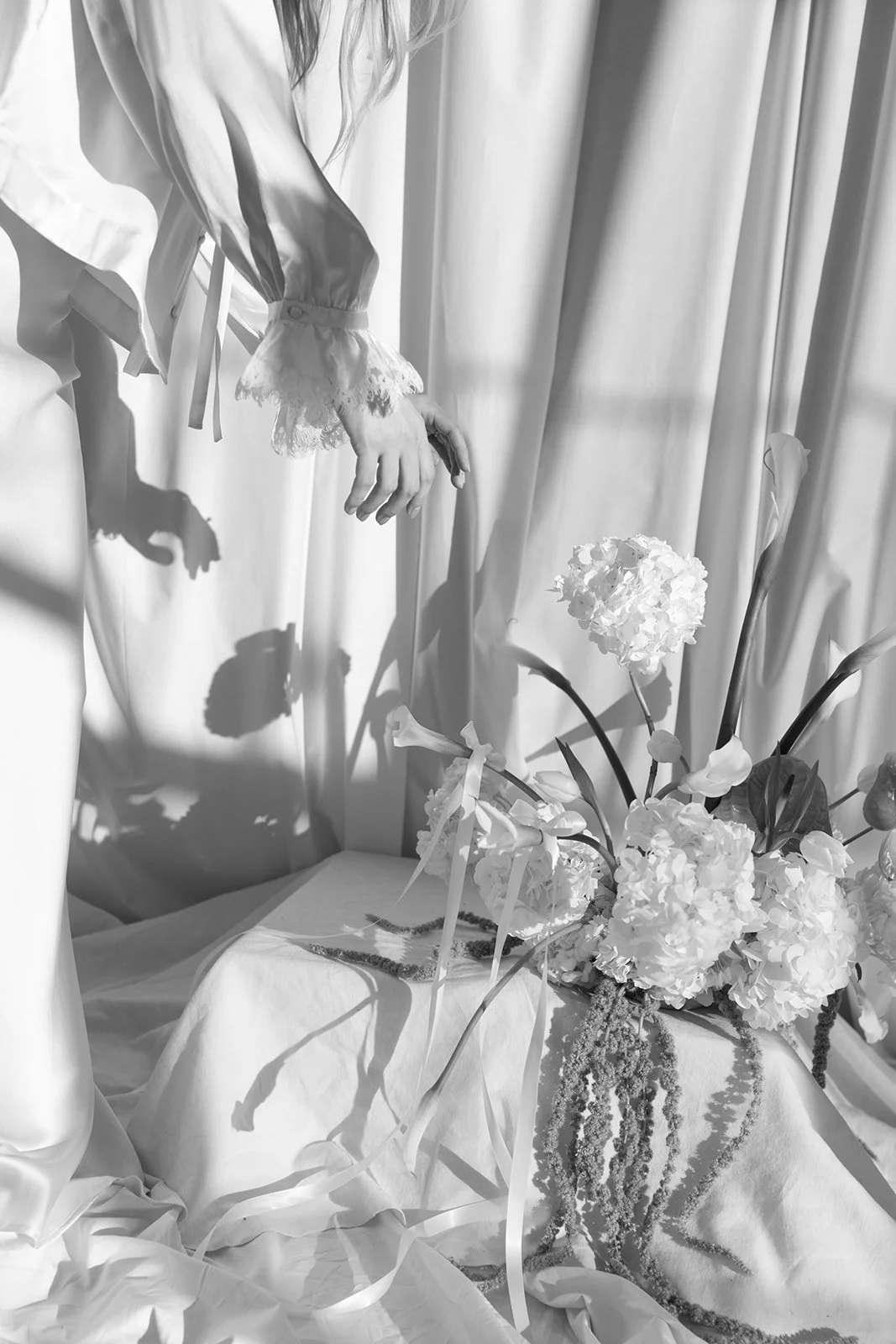 Modern chic branding shoot for an interior designer white and green flowers amaranth calla lilies anthurium hydrangea the cottage rose kansas city wedding florist crossroads pedestal floral installation draped fabric