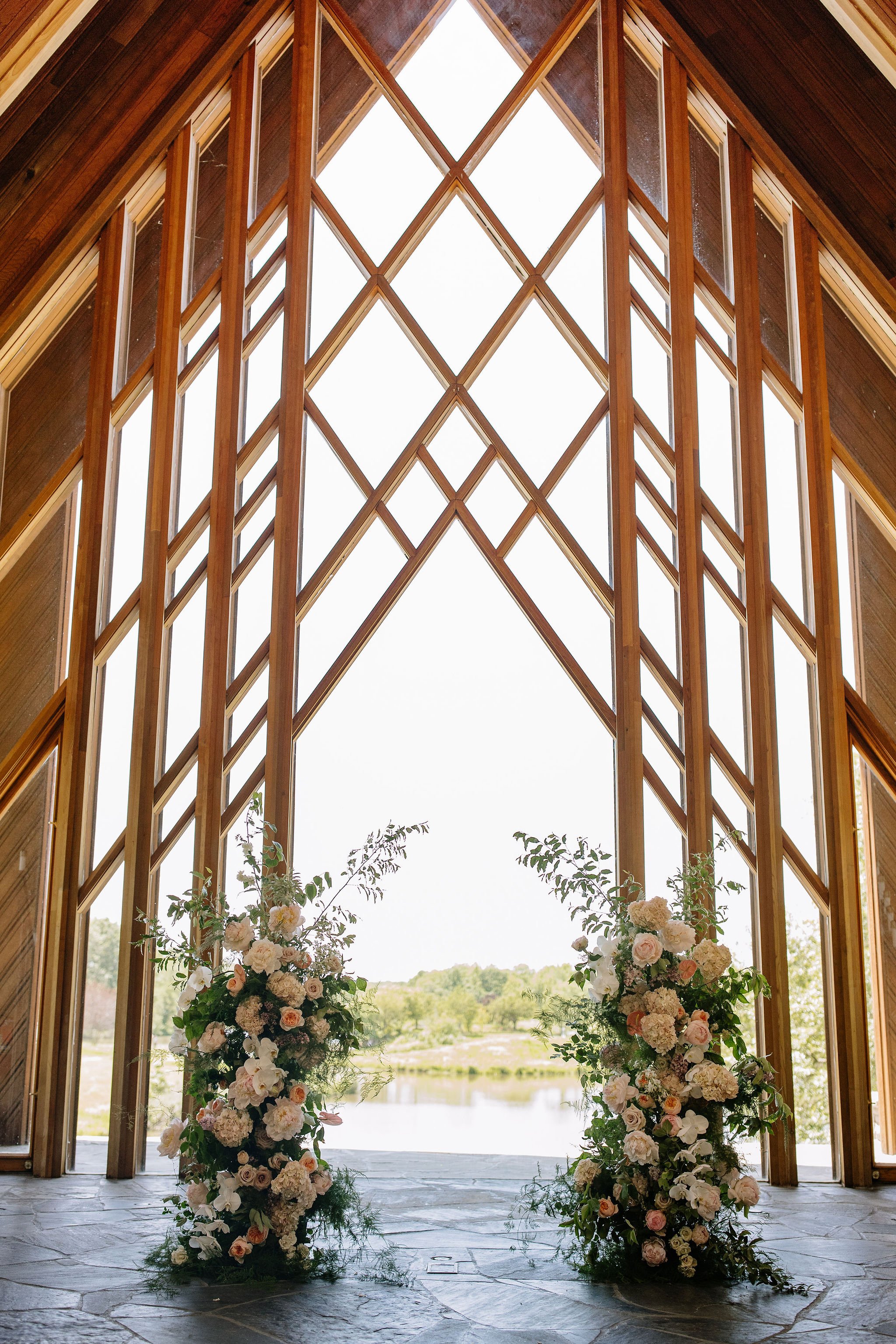 modern spring garden wedding warm color palette yellow peach lilac the cottage rose kansas city florist crossroads powell garden ceremony floral column installation ceremony flower arrangement peonies anthurium garden roses ranunculus orchids