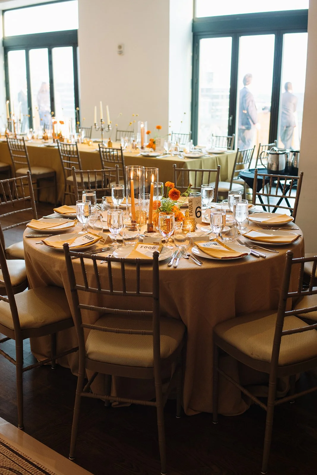 Modern september wedding reception orange and yellow color palette craspedia bud vases centerpieces silver candelabra  the cottage rose kansas city wedding florist crossroads hotel kansas city wedding orange marigold ikebana centerpiece