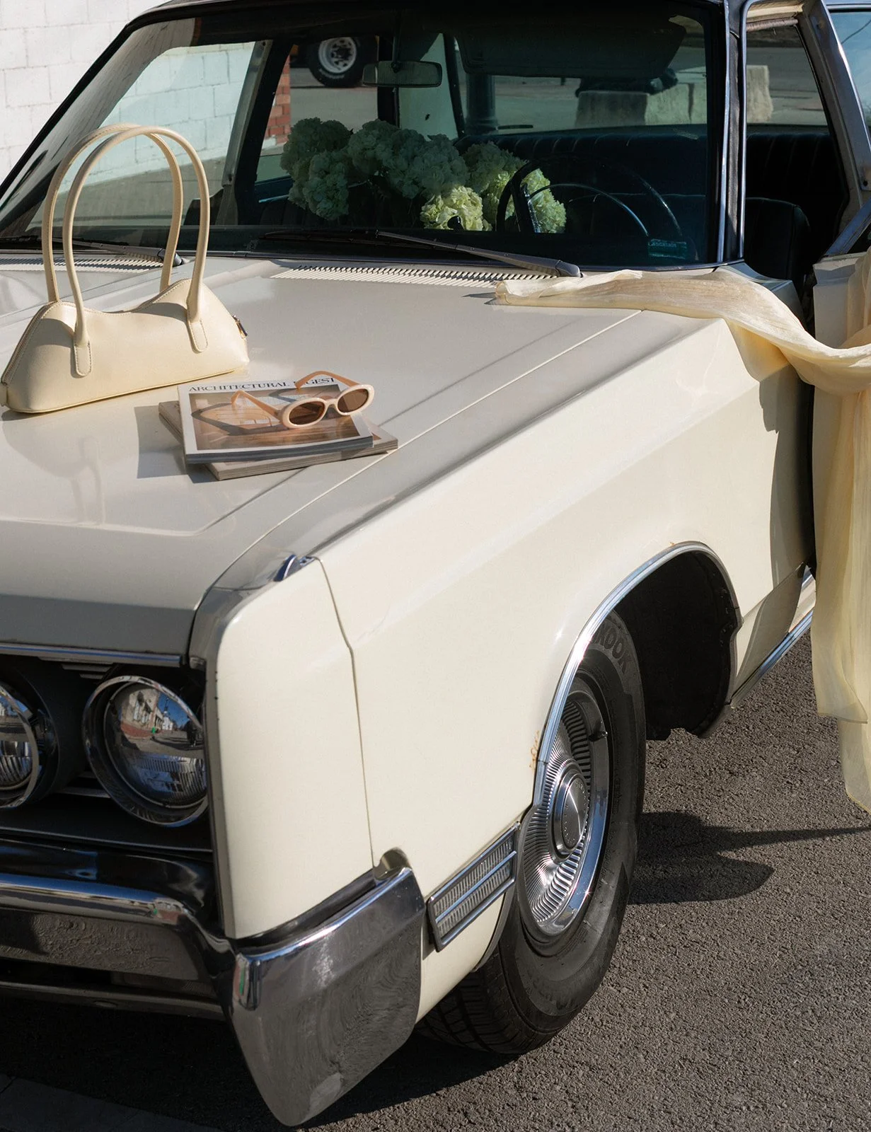 vintage car tulip bouquet wrapped the cottage rose kansas city wedding florist crossroads branding shoot interior designer hydrangea butter yellow purse sunnies magazine