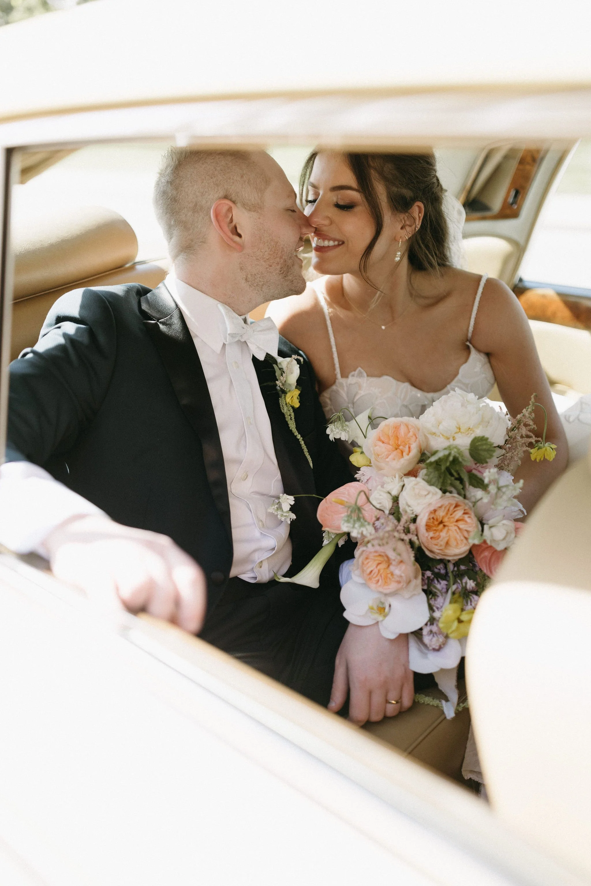 modern spring garden wedding large statement bridal bouquet bride and groom portraits bridal style the cottage rose kansas city florist crossroads powell garden ceremony vintage car