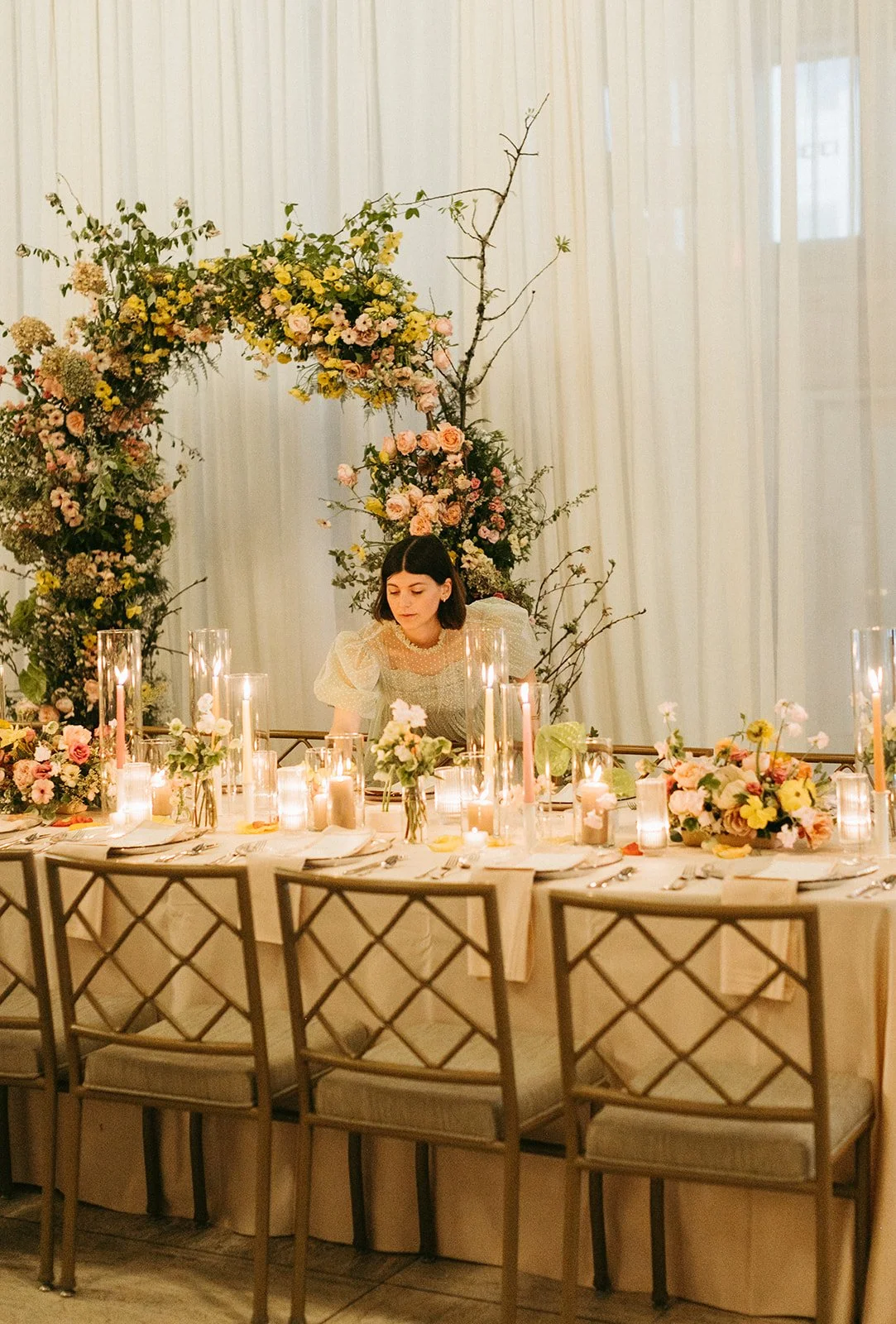 reception flowers large lush floral arch ceremony backdrop head table flowers and candlesmodern garden wedding flowers  the grand hall downtown kc the cottage rose kansas city wedding florist crossroads