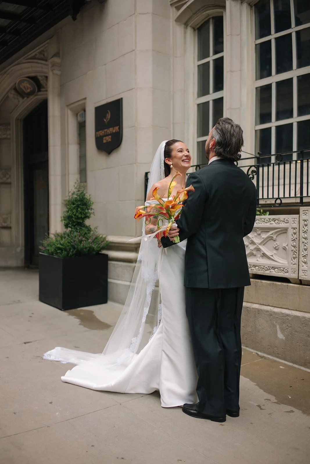 Modern september wedding orange and yellow calla lily bridal bouquet wedding bride and groom first look the cottage rose kansas city wedding florist crossroads hotel kansas city wedding