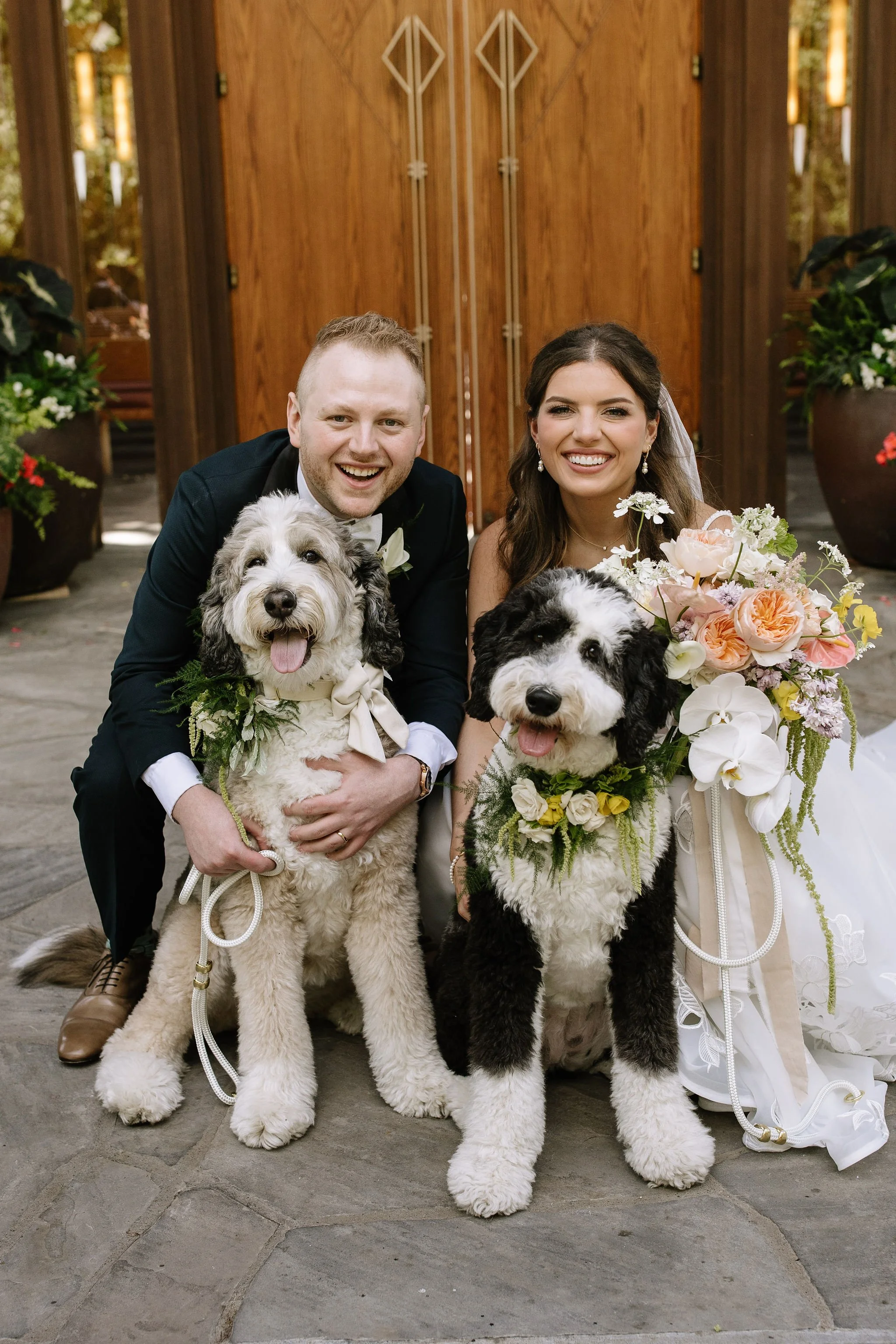 modern spring garden wedding large statement bridal bouquet bride and groom portraits bridal style the cottage rose kansas city florist crossroads powell garden ceremony dog floral collars family portrait