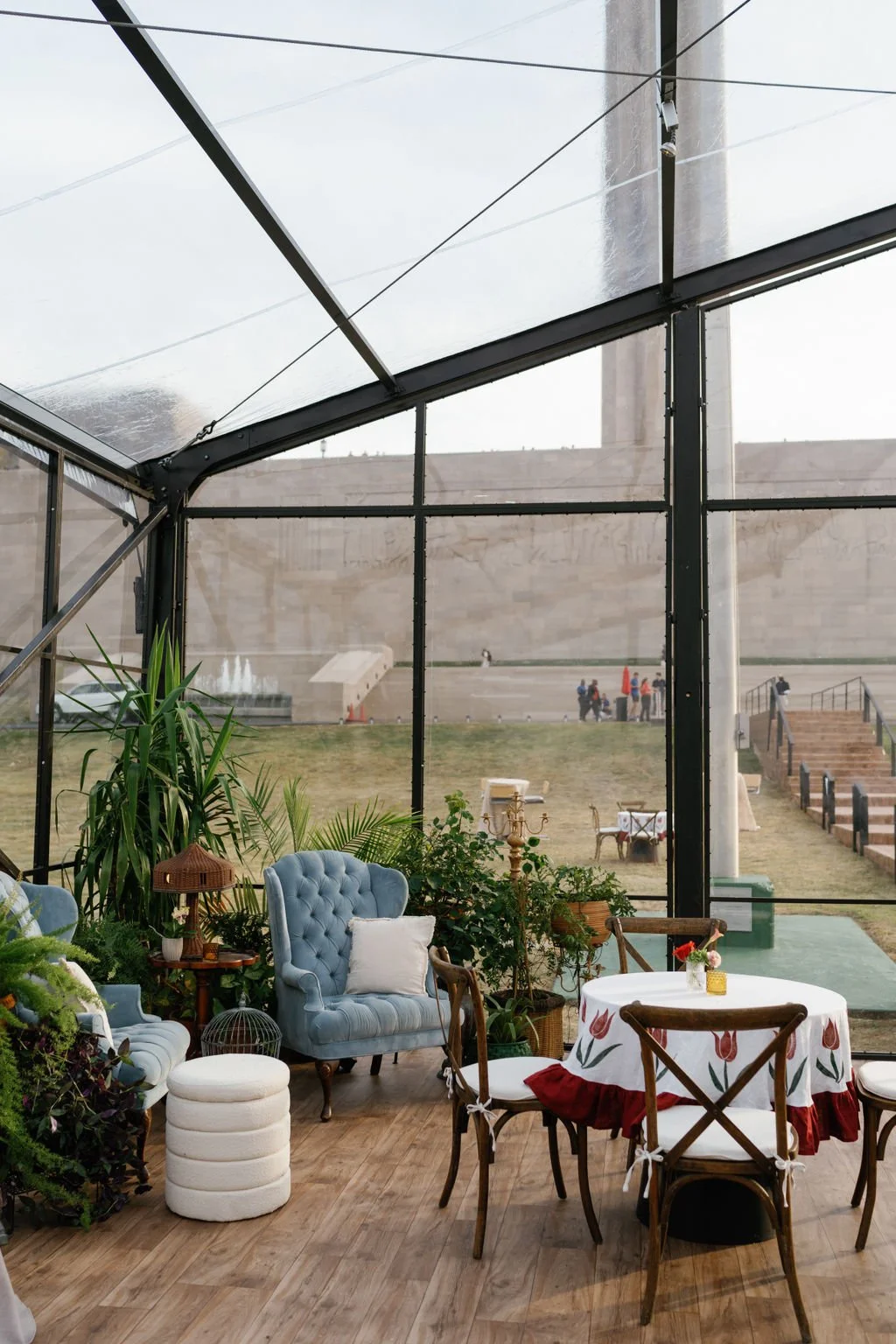 Modern eclectic luxury wedding on the lawn at liberty memorial greenhouse tent wedding outdoor reception fall wedding decor october wedding the cottage rose kansas city wedding florist crossroads centerpieces lamps candles plant styling vintage chair