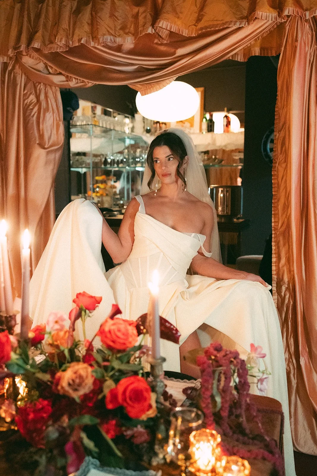 Vintage maximalist more is more wedding inspiration full lush florals pop of red modern corset bridal look le lounge kansas city wedding florist the cottage rose crossroads spring wedding decor brown fabric orchids amaranth bride kc fringe