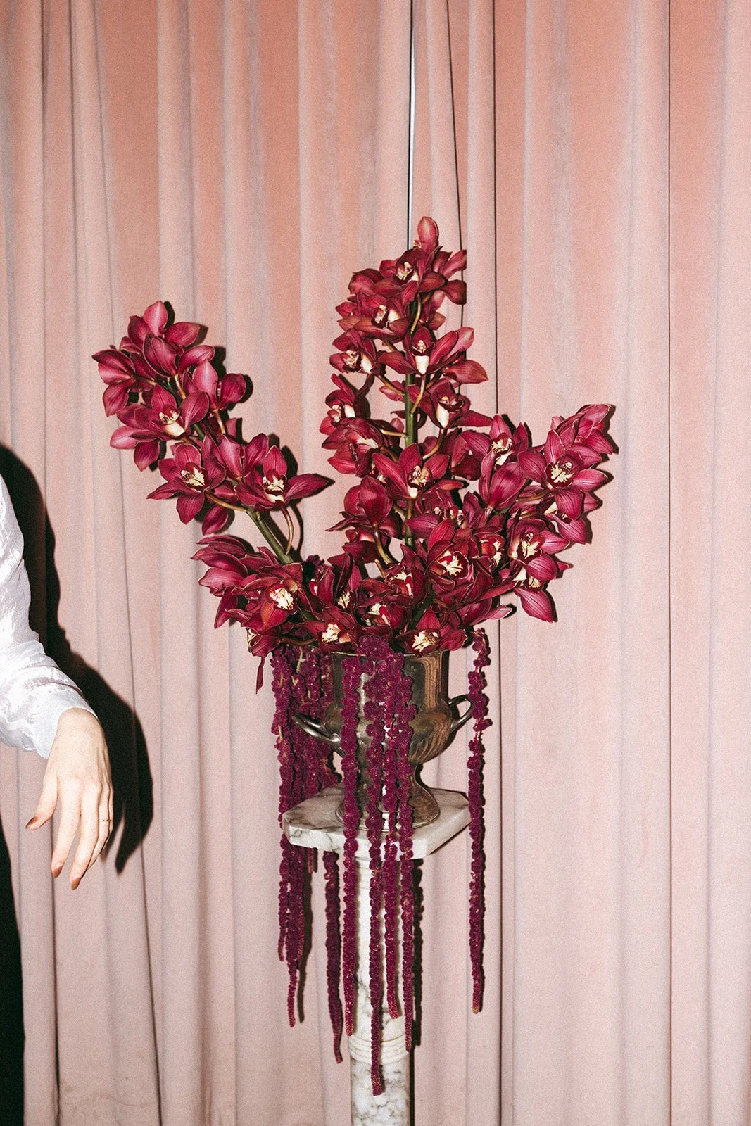 Vintage maximalist more is more wedding inspiration full lush florals pop of burgundy le lounge kansas city wedding florist the cottage rose crossroads spring wedding decor brown fabric orchid amaranth silver urn marble pedestal pink fabric