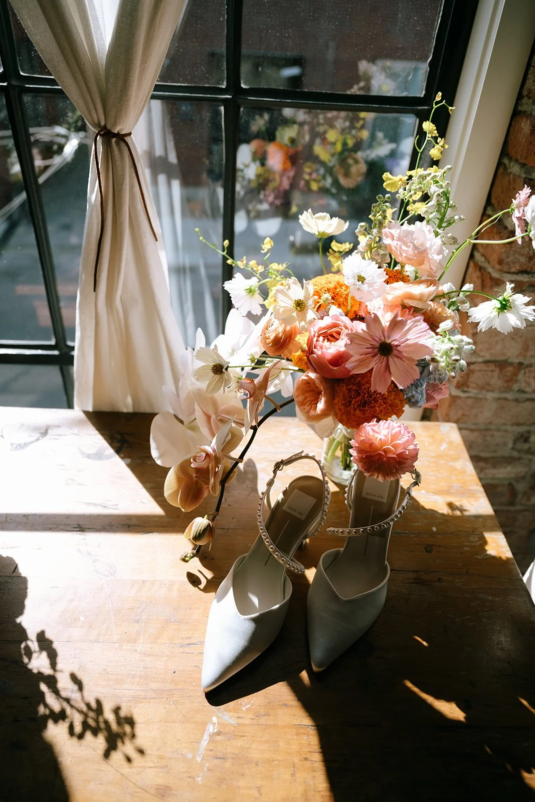 colorful flower filled october wedding in midtown kansas city la villa bridal bouquet wedding bouquet wedding flowers orchids garden roses ranunculus the cottage rose kansas city wedding florist crossroads