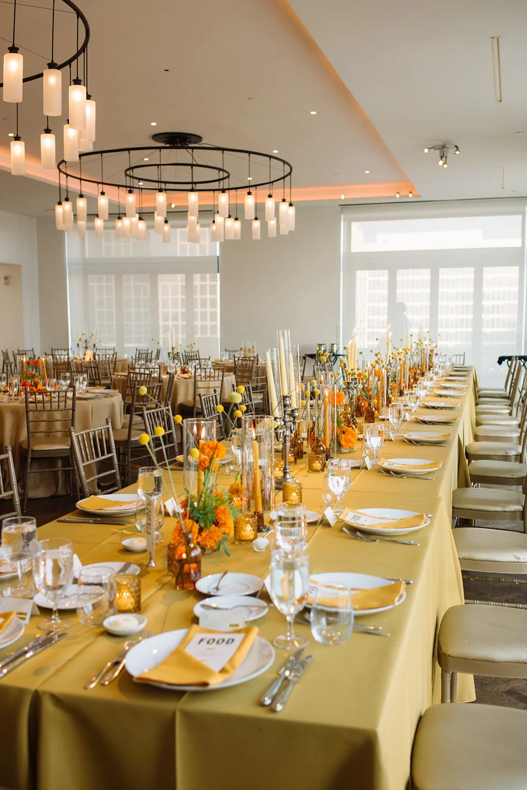Modern september wedding reception orange and yellow color palette craspedia bud vases centerpieces silver candelabra  the cottage rose kansas city wedding florist crossroads hotel kansas city wedding orange marigold ikebana arrangement head table