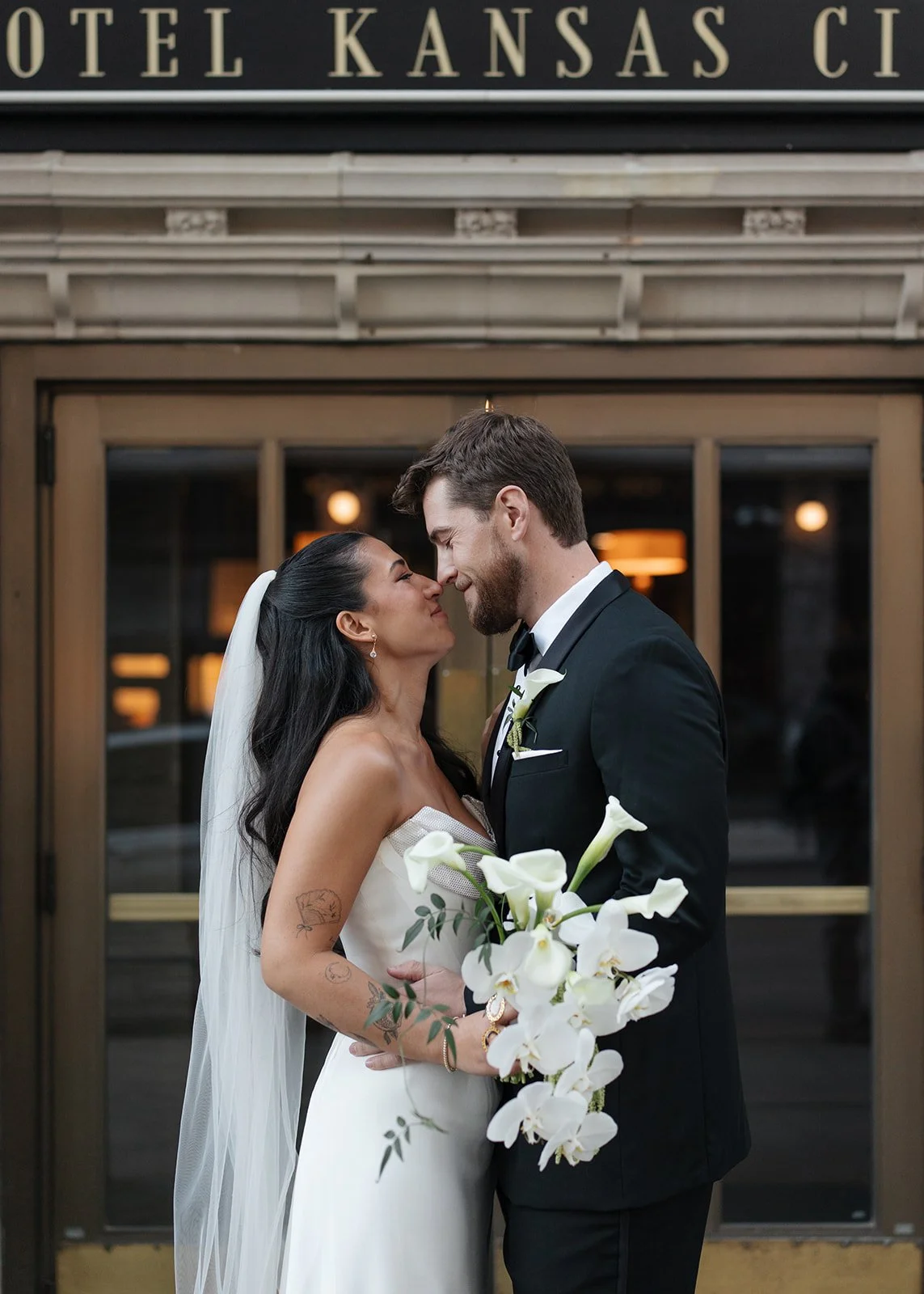 Modern chic november fall wedding downtown hotel kansas city orchids calla lilies amaranth bouquet anthurium bride groom portrait chic bridal style the cottage rose kansas city wedding florist crossroads